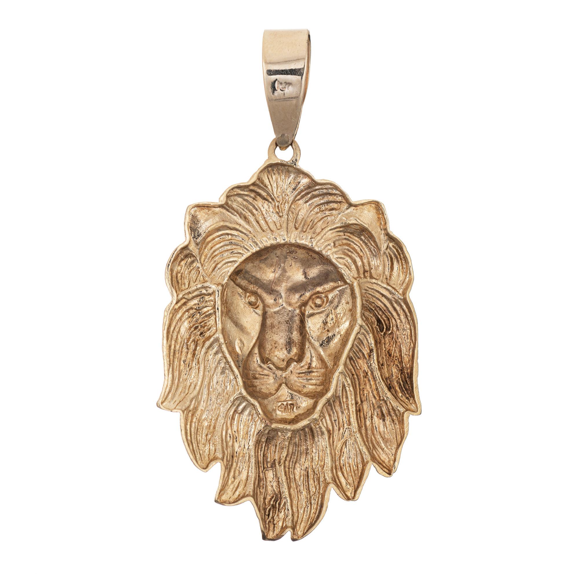 Finely detailed large Lion pendant crafted in 10k yellow gold (circa 1980s to 1990s).  

The large pendant (2 1/2 inches) features the face of a Lion. The elaborate pendant has a lightweight feel with a substantial look. The pendant is great worn