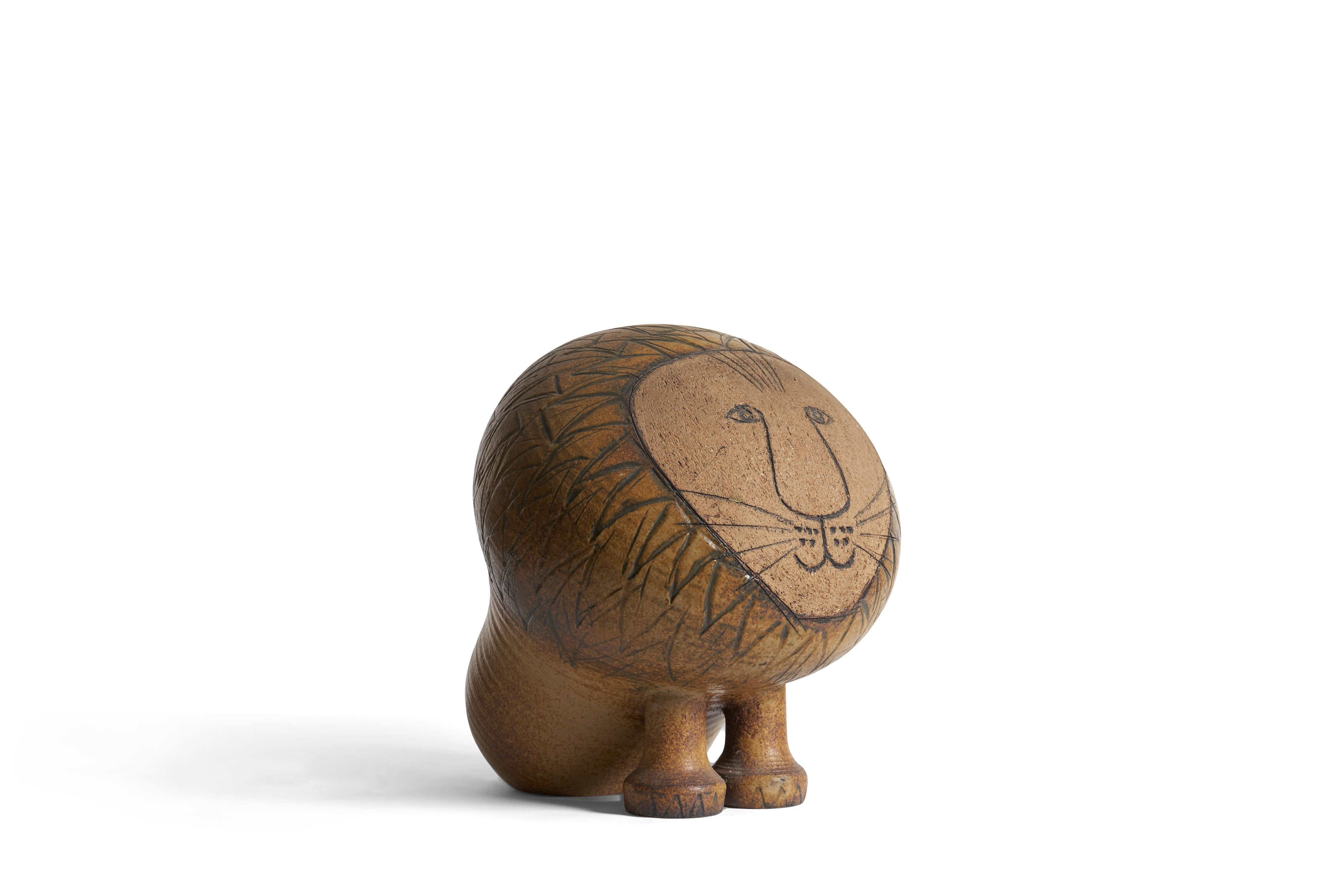 The largest and most rare of Lisa Larson's iconic Lion forms from the Africa (Afrika) Series made by Gustavsberg Ceramics factory in Sweden.
It was produced in 3 sizes. This size is the largest of the series measuring: 16