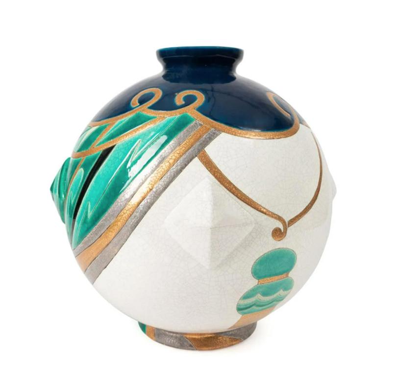 Danillo Curetti (Swiss 1953-1993), for Longwy (French 1798), limited edition globular pottery vase in the Art Deco taste having blue green, and metallic geometric decoration, marked to the underside and numbered 3/150. 

dimensions: h. 15.25