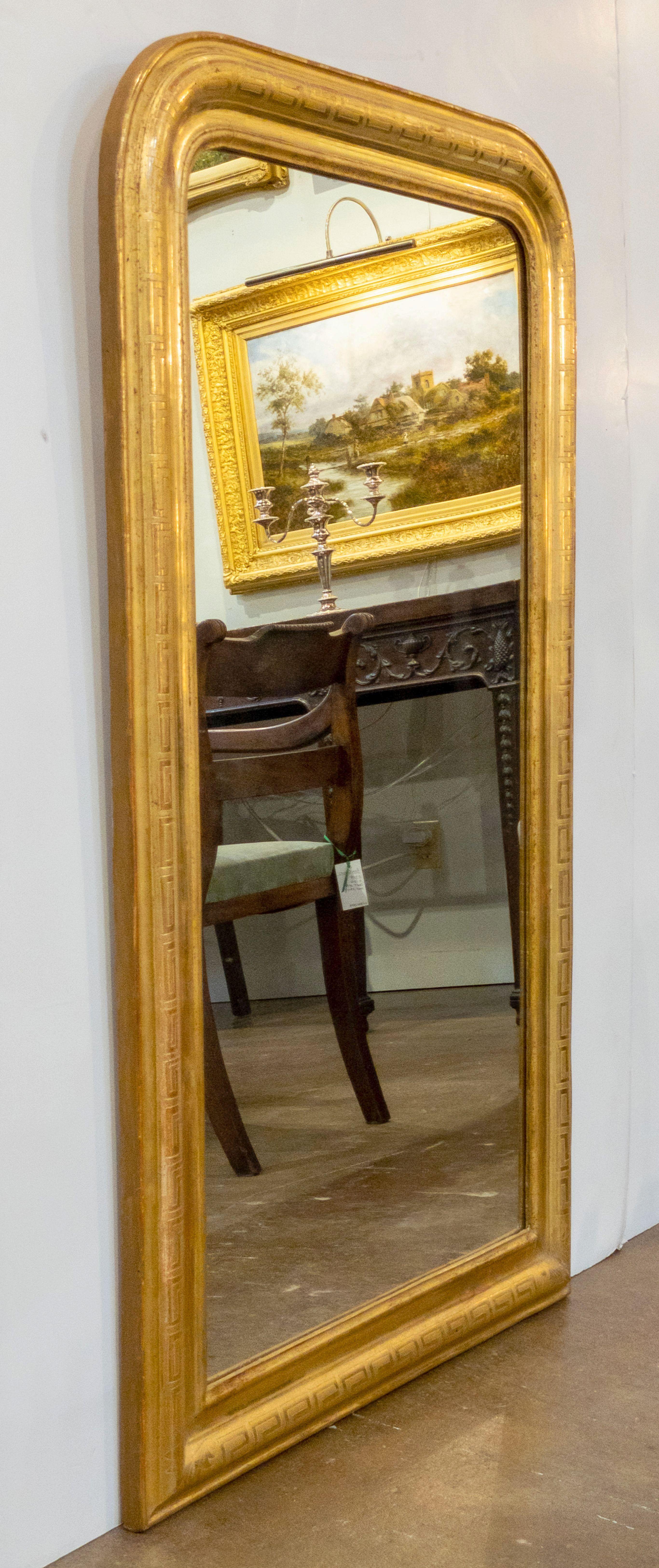 A handsome large Louis Philippe gilt wall mirror from France, featuring a lovely moulded surround and an etched Meander or 