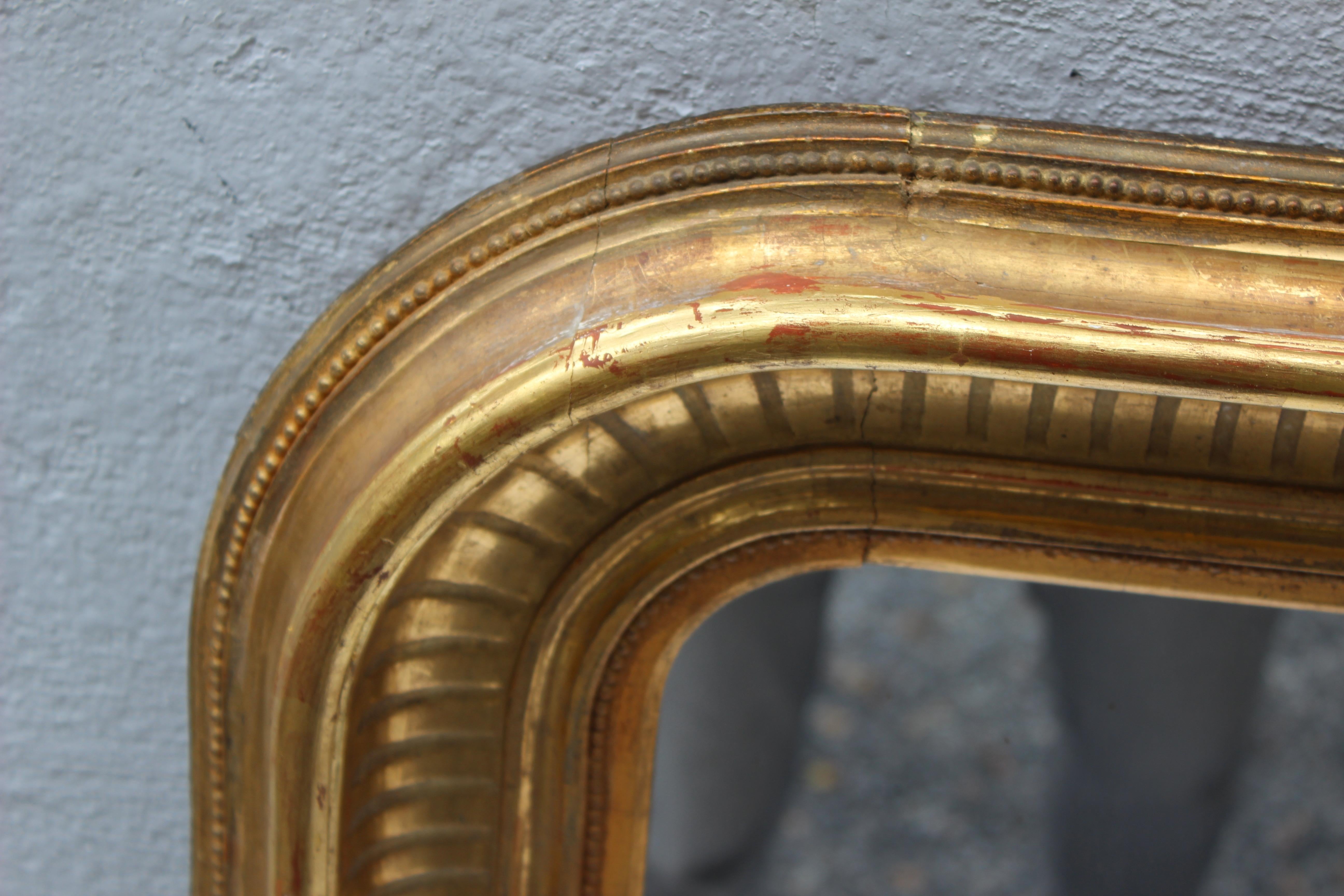 Gilt Louis Philippe mirror which can be hung horizontally or vertically.