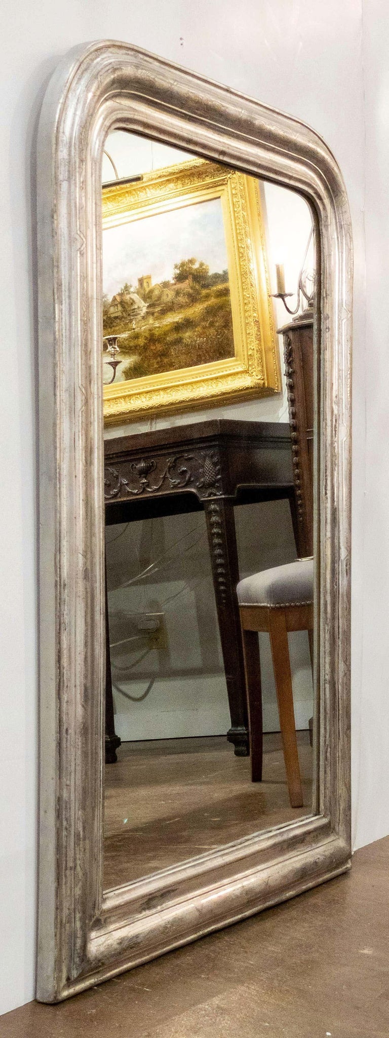 A fine Louis Philippe wall mirror from France, featuring a moulded surround with a beautiful patinated silver-leaf.

Dimensions: H 42 3/4 inches x W 30 1/2 inches

Other sizes available in this style.