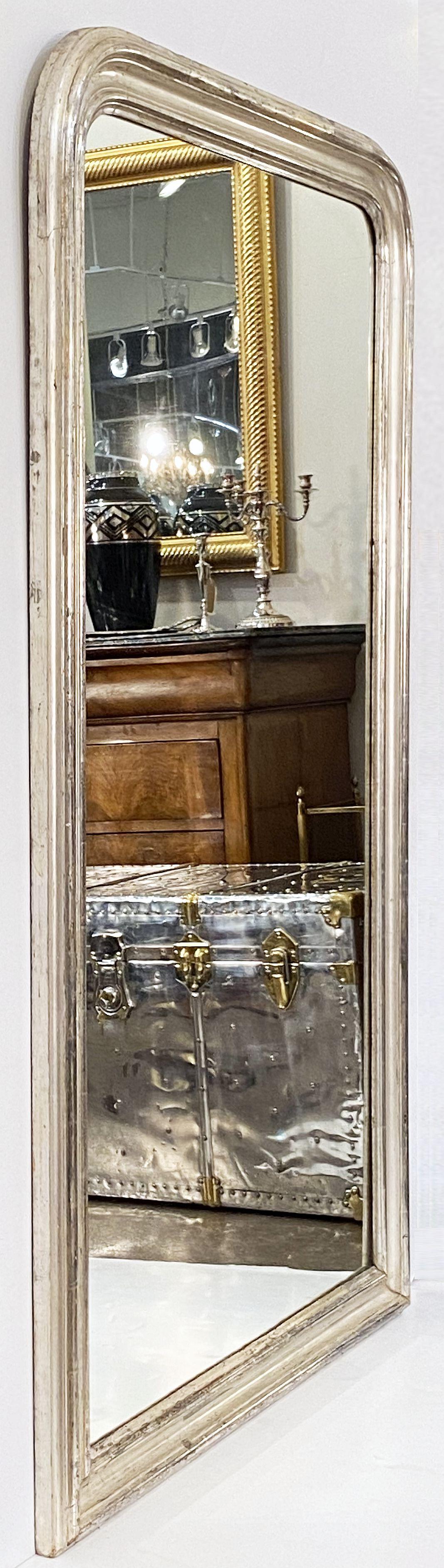 A fine tall Louis Philippe wall or dressing console mirror from France, featuring a moulded surround with a beautiful patinated silver-leaf.

Dimensions: H 62 3/4 inches x W 37 1/4 inches

Other sizes available in this style.


