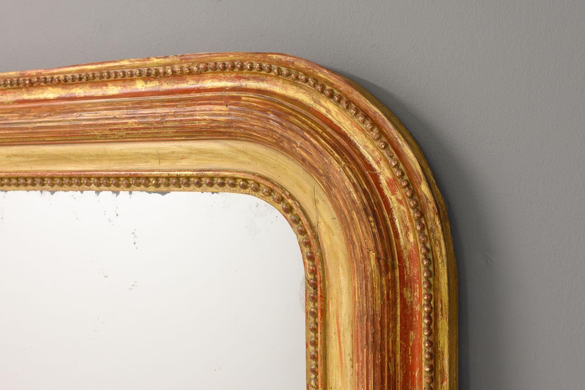 Large Louis Philipe French mirror with aged gilding and original foxed mirror plate. Circa 1870
H 202cm x W 132cm x D 7cm