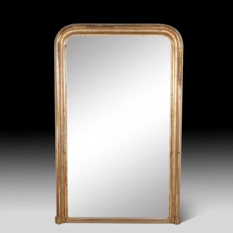 Mid 19th century French Louis Philippe gilt-framed mirror. The mirror is original and in very good condition with a lovely flecked patina. This piece could sit on the floor as a full length dressing mirror. Circa 1850.