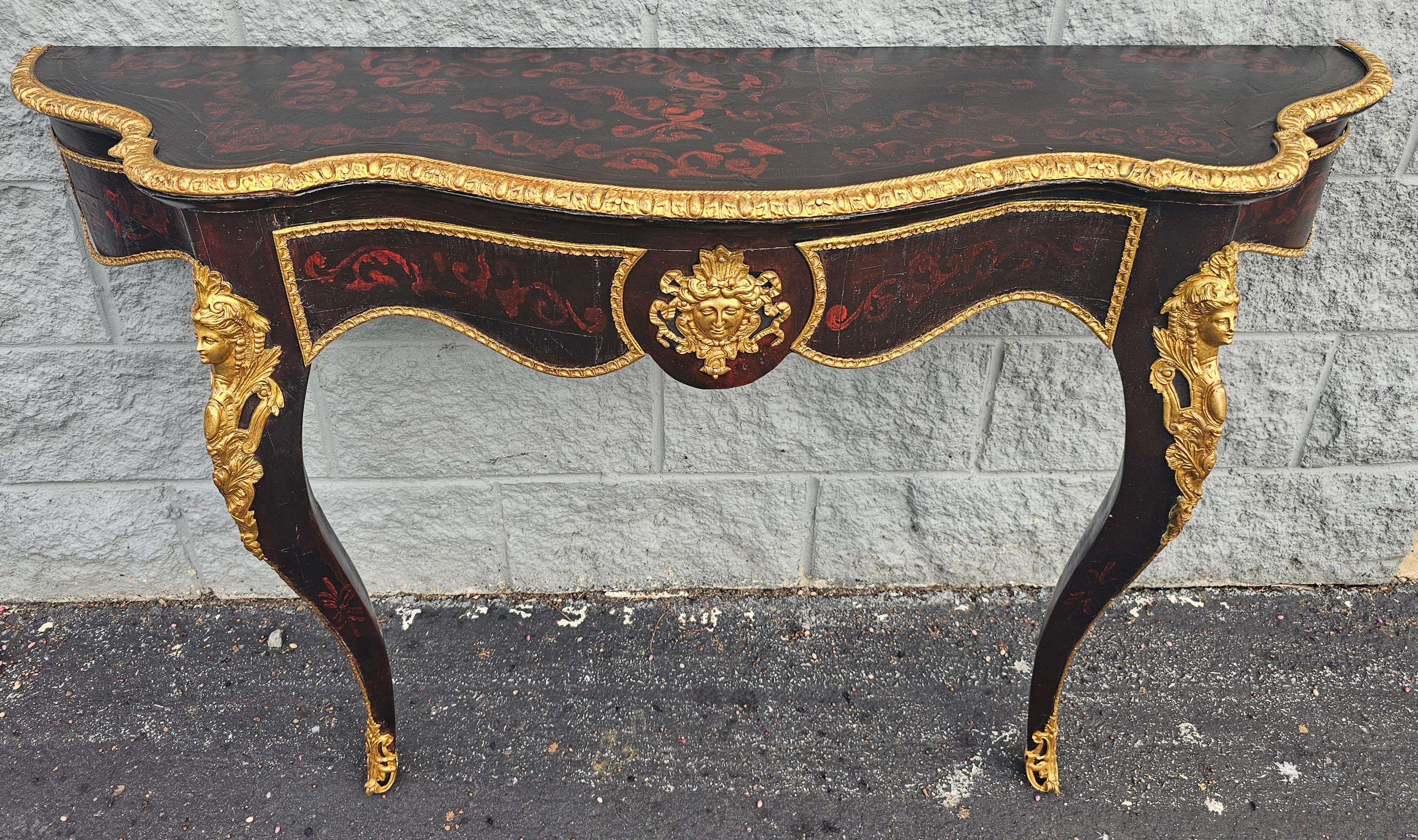 Large 51 inches, Stunning 1840s Louis Phillipe revival console wall table with Intricate giltwood work , very elegant gold bronze ormolu.
Old black Painted. Good antique condition. Wear appropriate with history and use. Measures 51 inches in width,