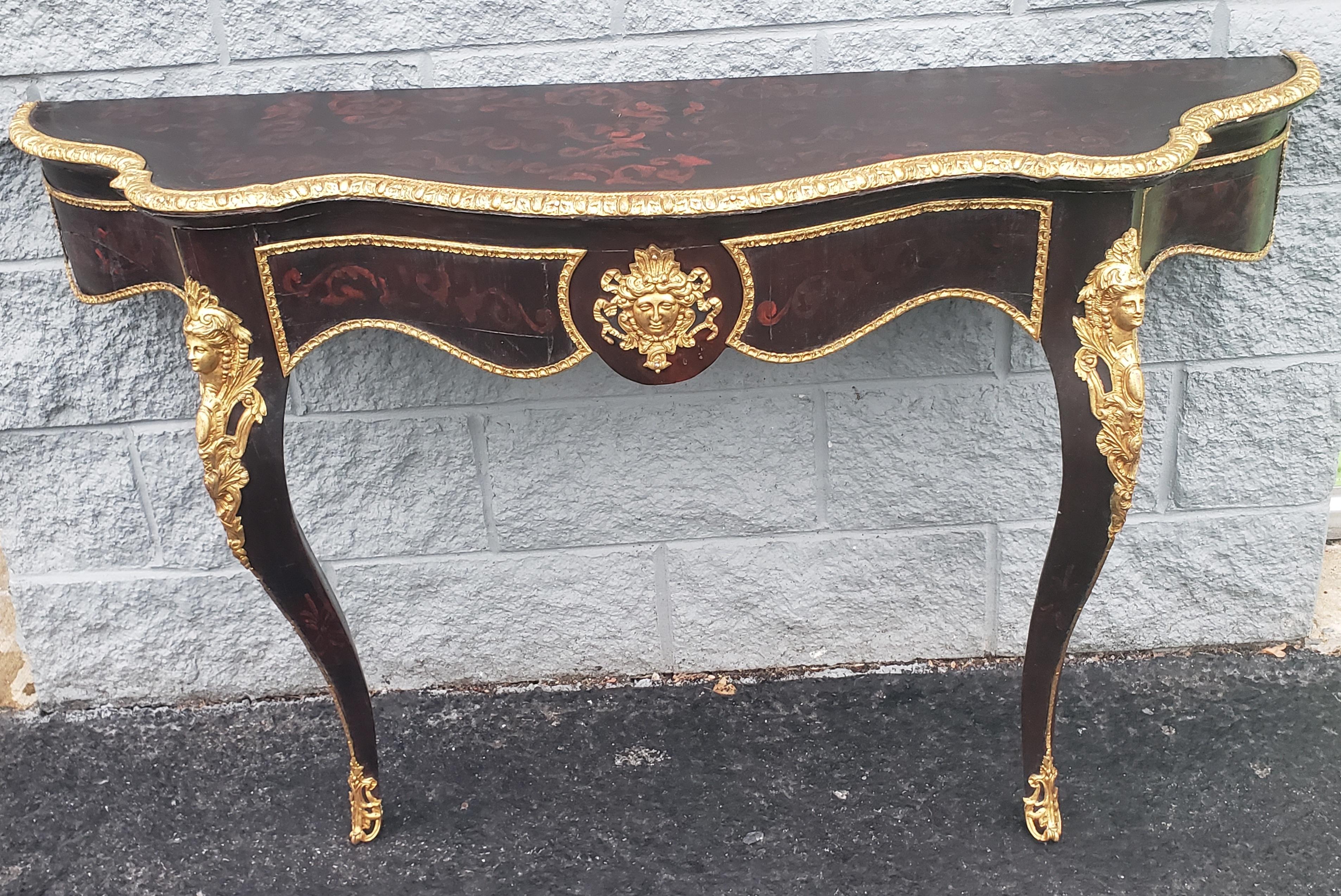Large 51 inches, Stunning 1840s Louis Phillipe revival console wall table with Intricate giltwood work , very elegant gold bronze ormolu.
Old black Painted. Good antique condition. Wear appropriate with history and use. Measures 51 inches in width,