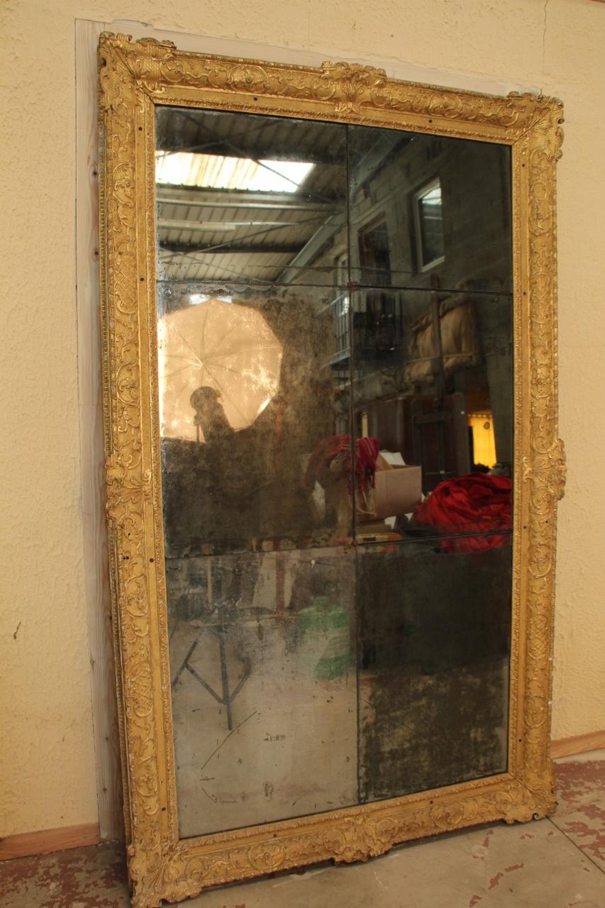 Large mercury mirror Louis XIV period gilded wood, size outside standards in very good condition, wear of time on mercury and gilded wood beautiful quality of work, probably Parisian work, carved on oak. Measures: 230 Cm height.