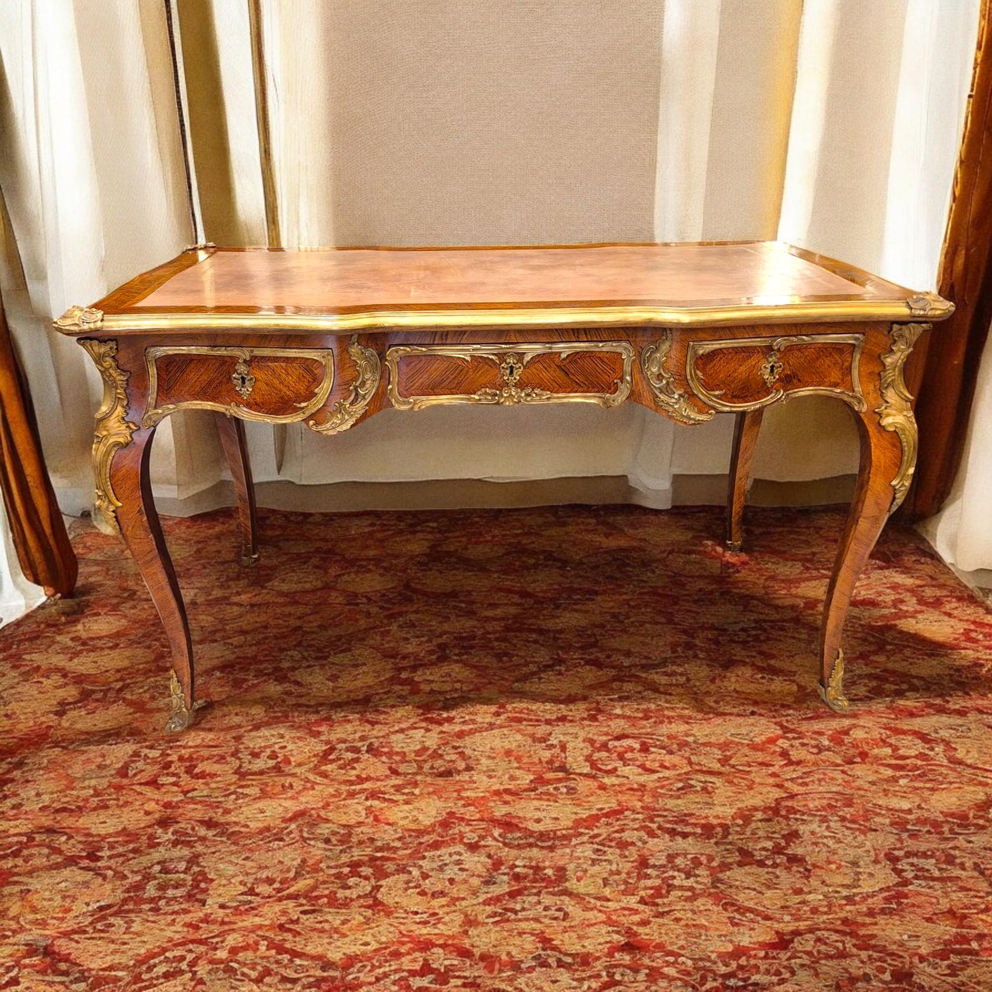 French Large Louis XV style flat desk, marquetry and gilt bronze, 19th century work For Sale