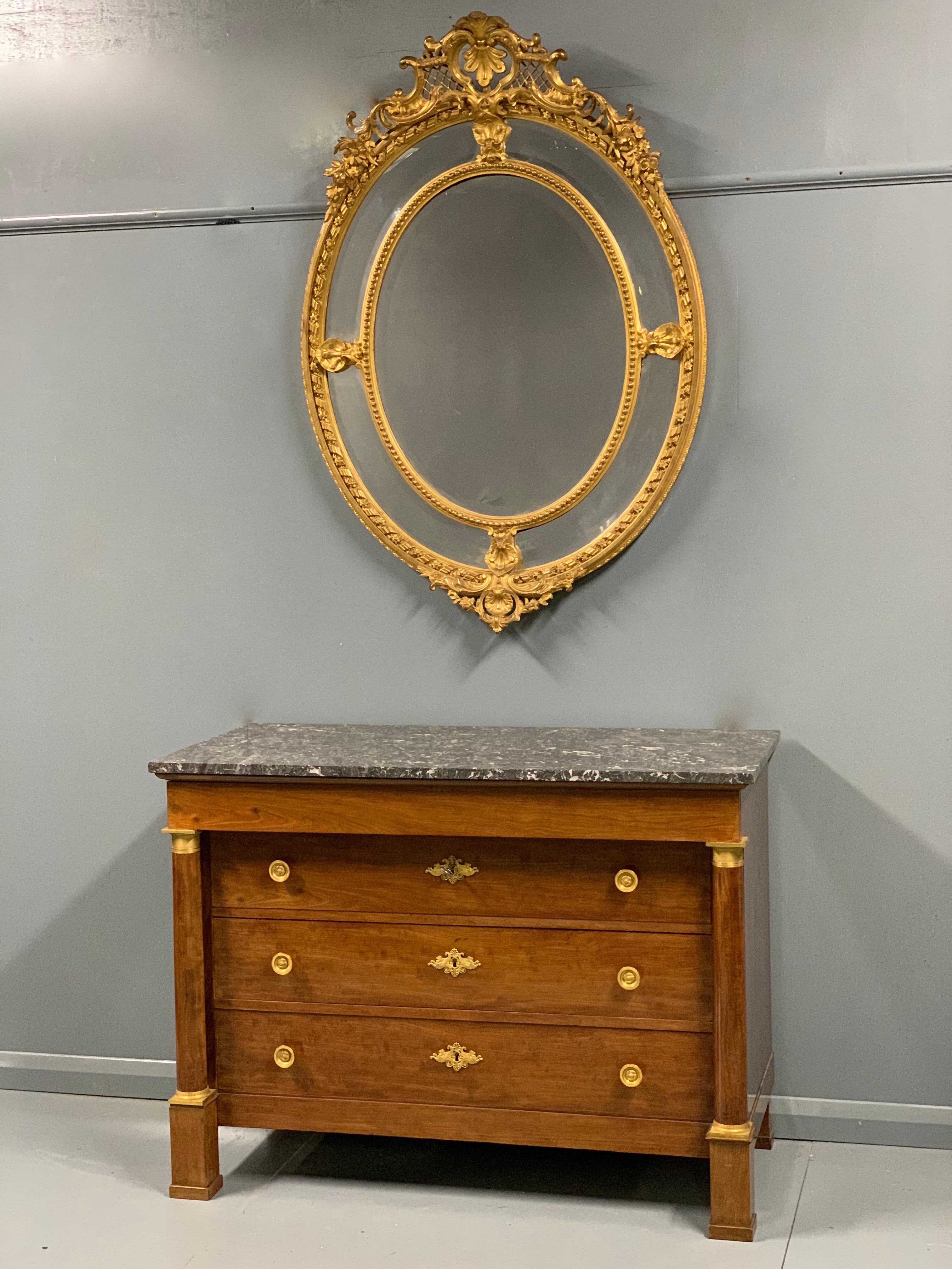 An exceptionally good quality and unusually large French 19th century Louis XVI style oval gilt mirror with all original bevelled edge mirror plates and retaining a lot of its original gold leaf.
The generous proportions of this mirror really do