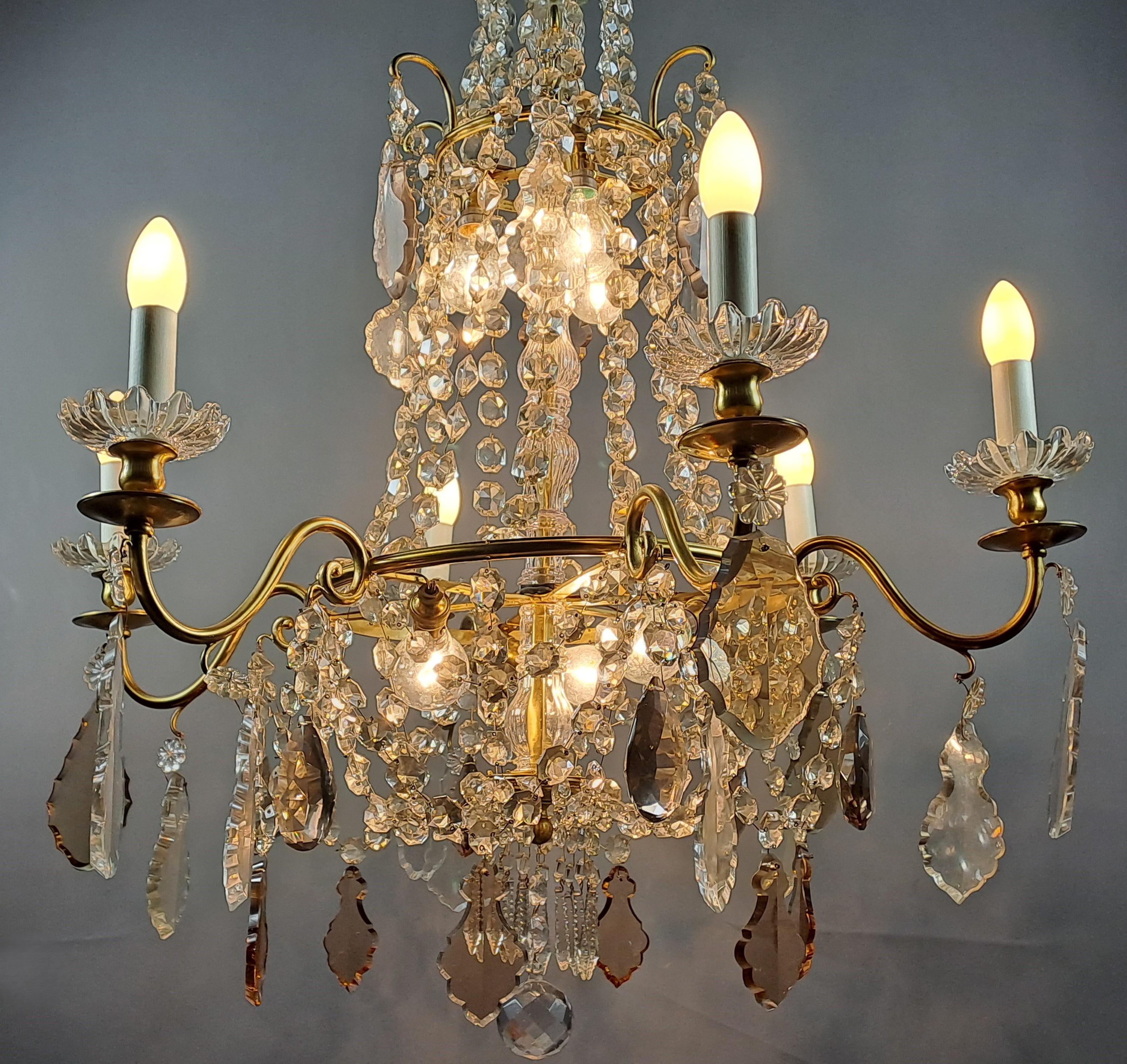 Very beautiful chandelier in the Louis XVI style in the shape of a hot air balloon with 6 light arms and 6 light points in the center.   Rich crystal ornamentation in the form of garlands, pendants (some of which are amethyst colored) and mirzas.  