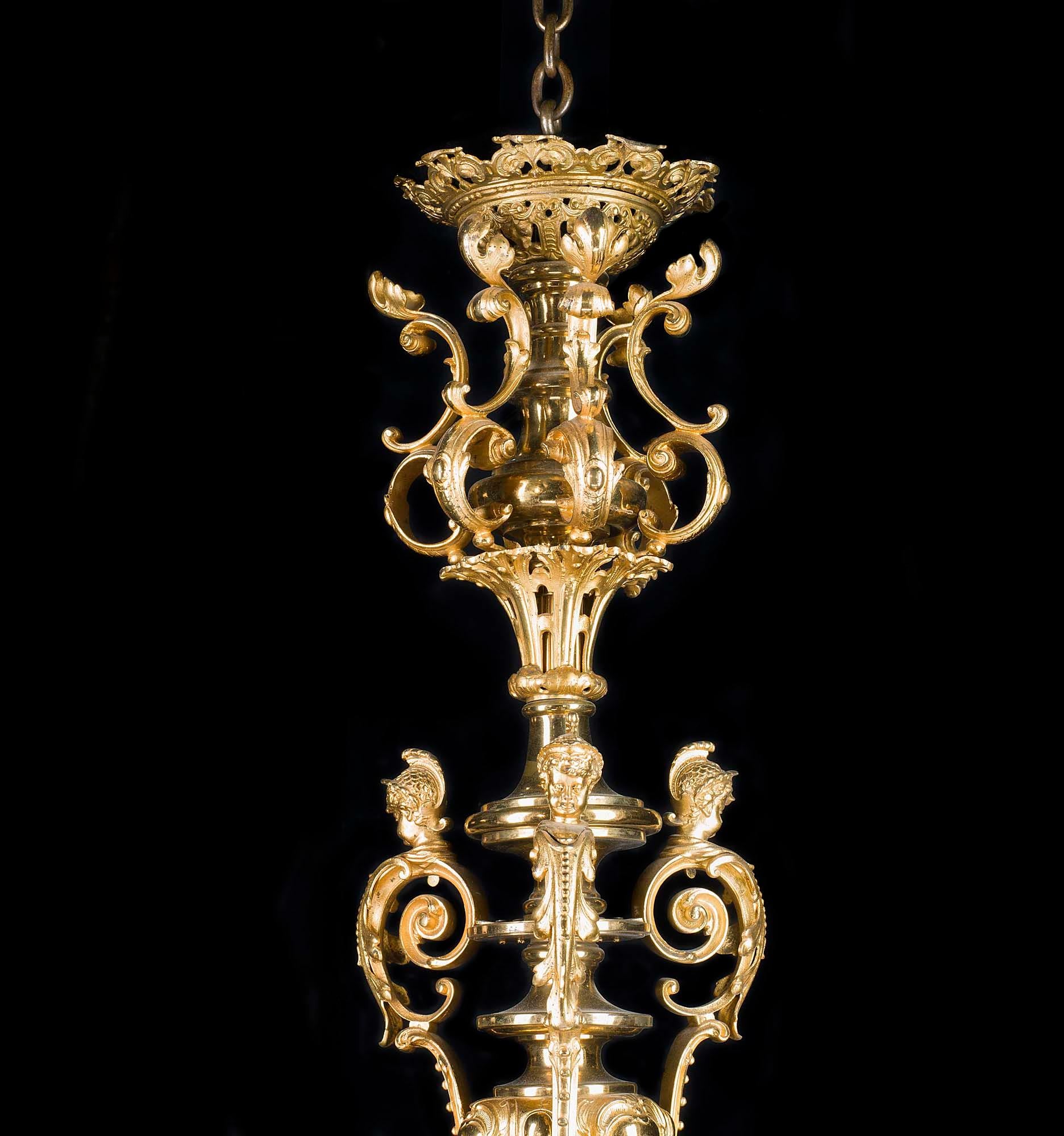 A very beautiful and large Louis XVI style six branch ormolu chandelier in the Rococo manner. The central stepped stem, suspended from a delicately cut dish corona resting on a bulbous vase framed amid scrolling foliate detail, is embellished by a