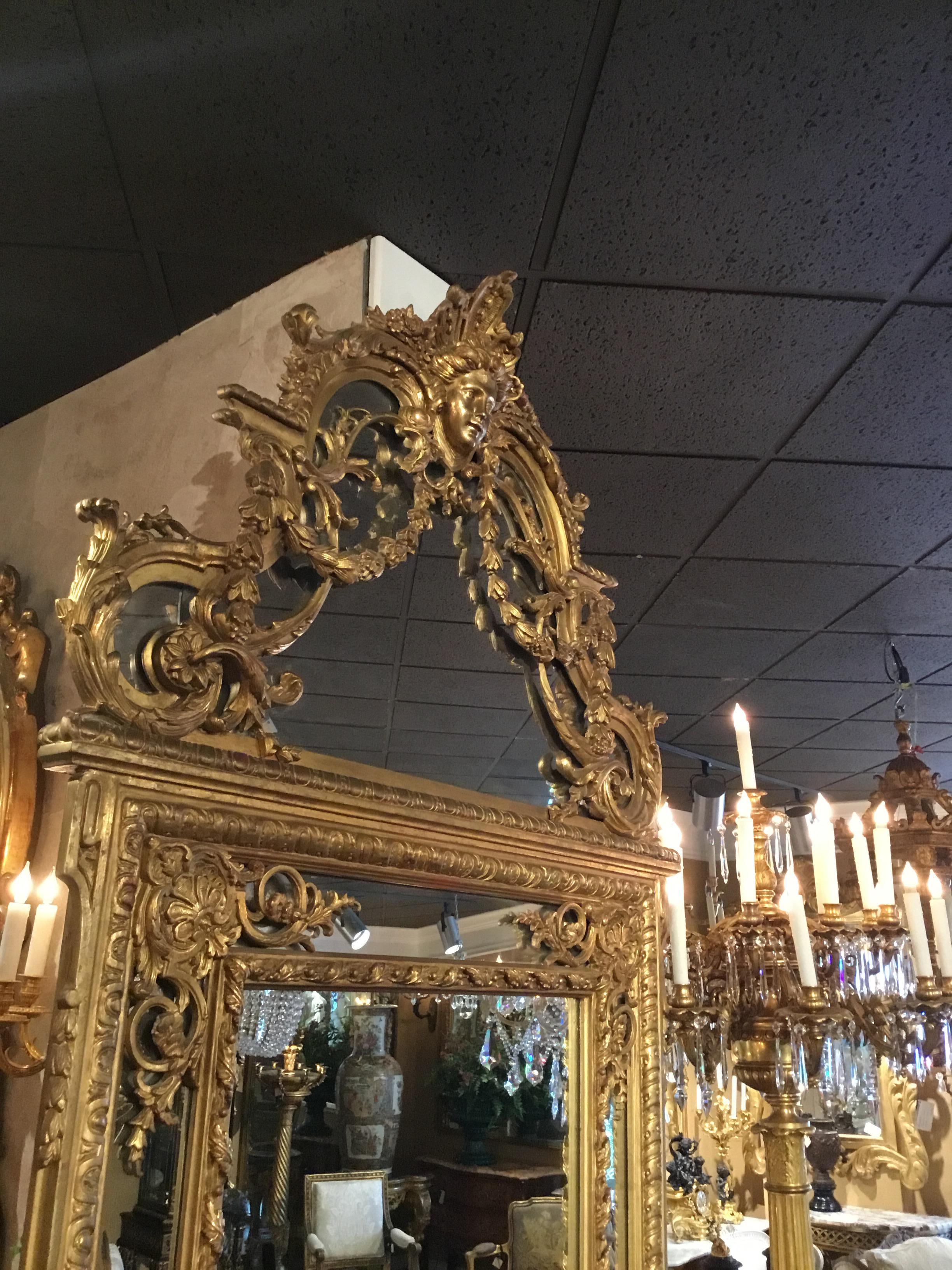Hardwood Large Louis XVI-Style Giltwood mirror With mask of Minerva, 19 th c. For Sale