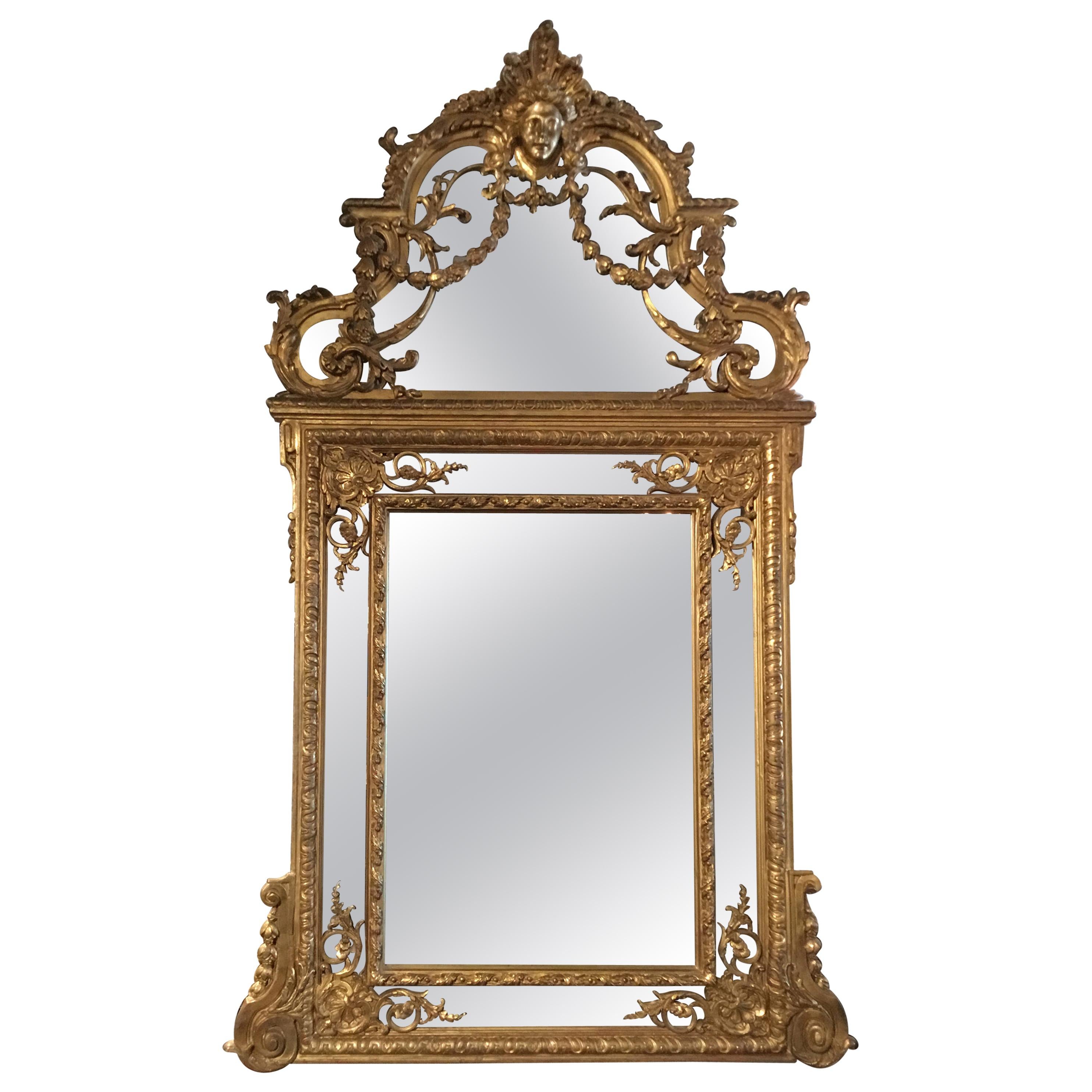 Large Louis XVI-Style Giltwood mirror With mask of Minerva, 19 th c. For Sale