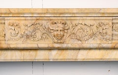 Grande cheminée de style Louis XVI en marbre jaune de Sienne