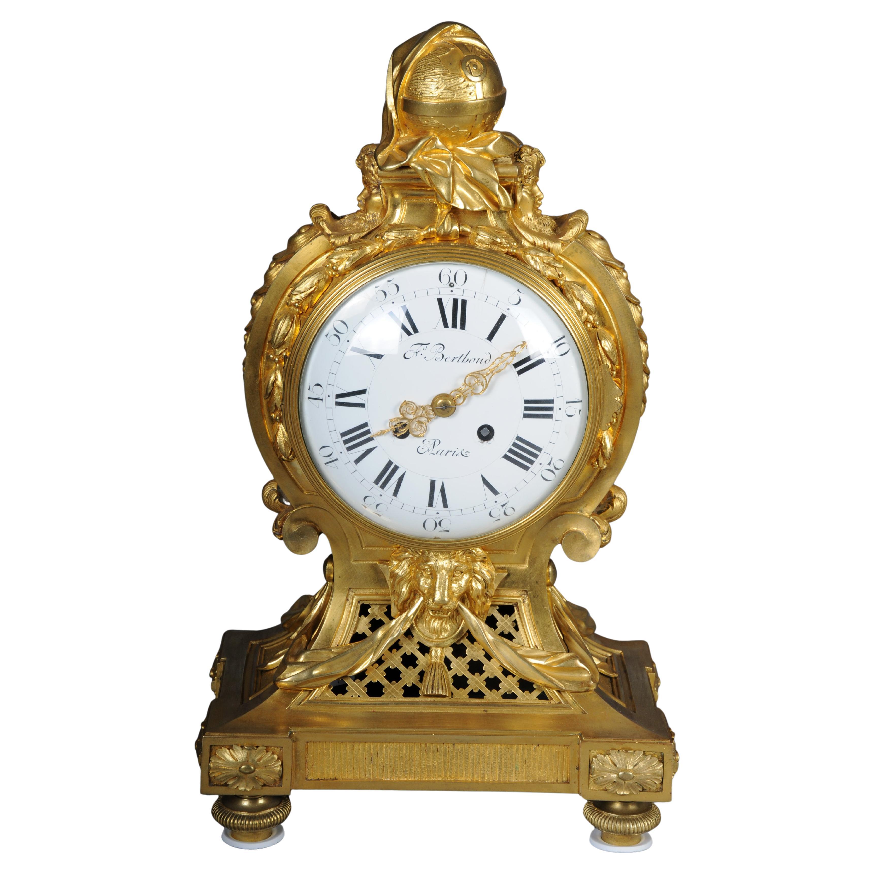Large Louis XVI-style pendulum clock
France, late 19th century
Bronze, gilt. On gyratory feet, a tapered, partially latticed case with lion masks, drapery, and scale decoration on the sides. A globe wrapped in drapery crowns the sides of satyr