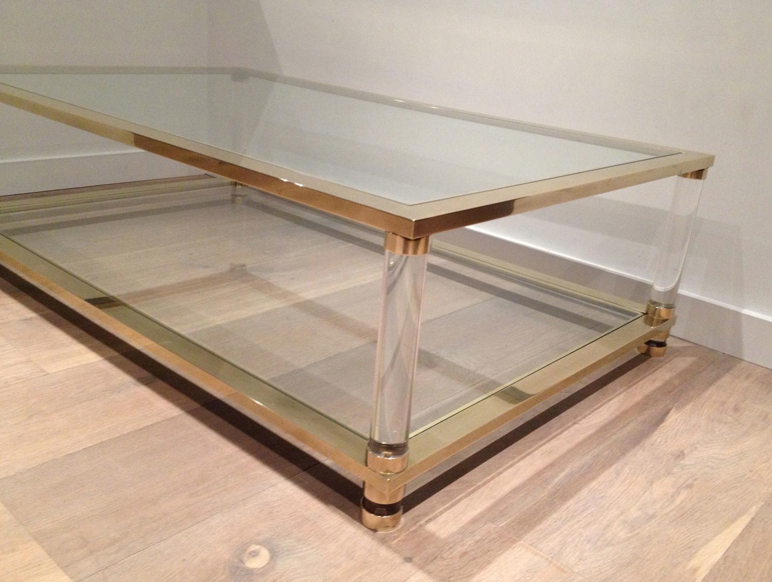 Brass Large lucite and brass coffee table. French work. Circa 1970