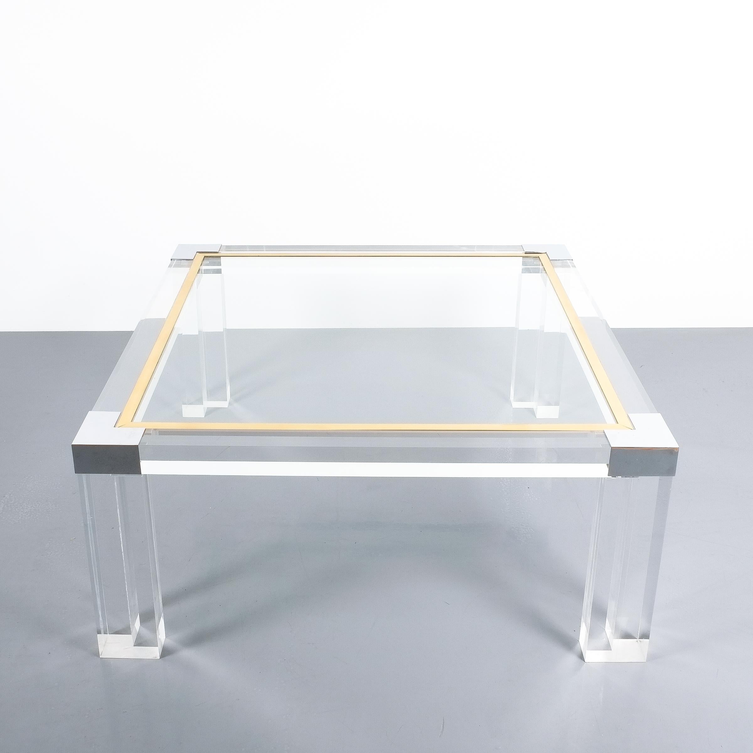 Large Lucite and brass coffee table style Charles Hollis Jones, circa 1970

Nicely sized 36 x 36 inch modernist Lucite coffee or cocktail table featuring solider Lucite and polished brass and chrome accents. Very elegant piece in very good