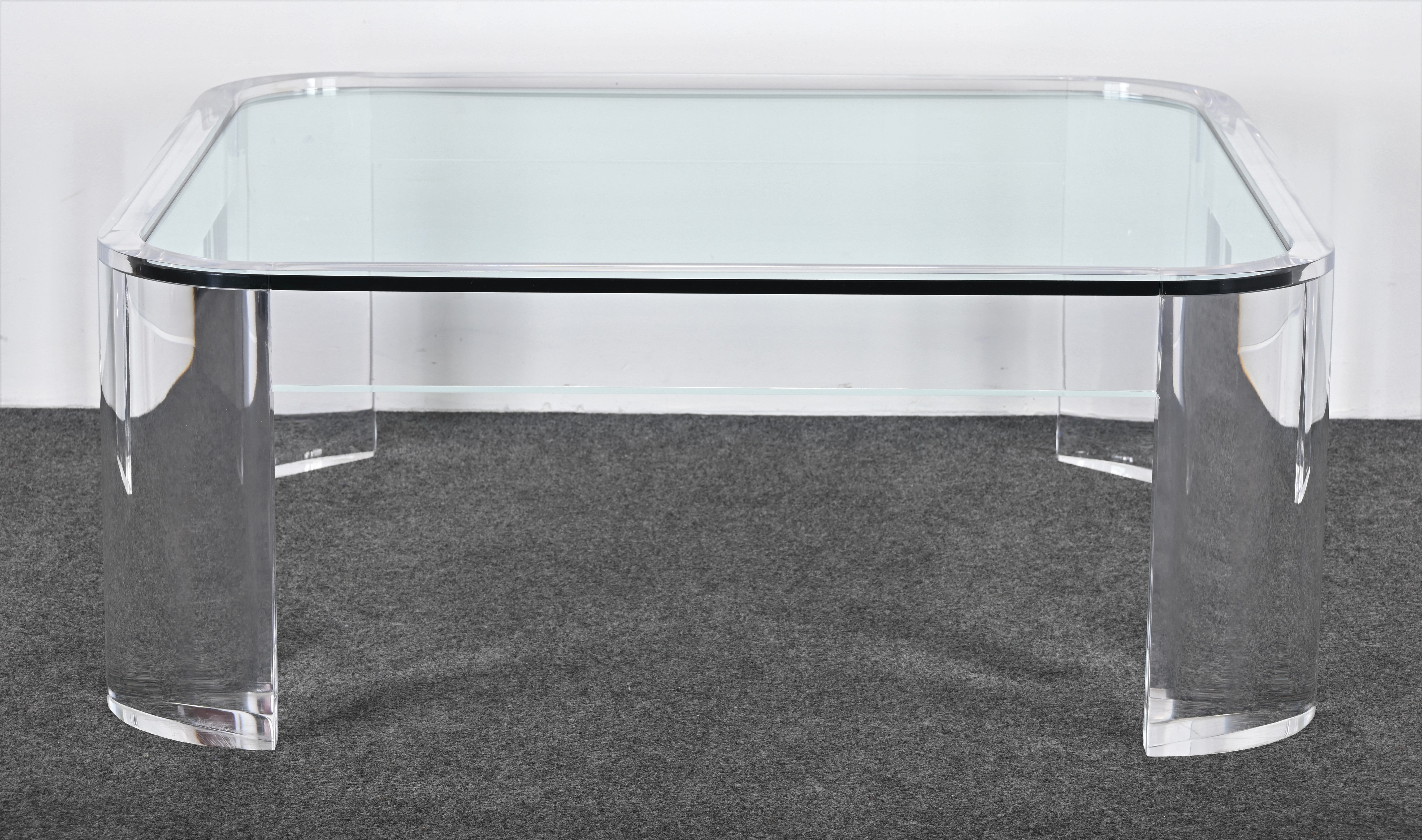 A large beautiful solid lucite table with radius corners and inset glass top by Les Prismatiques, USA, 1970s. This table would work well in a New York apartment or surrounded by decorative furnishings. It is a classic design that has been used for