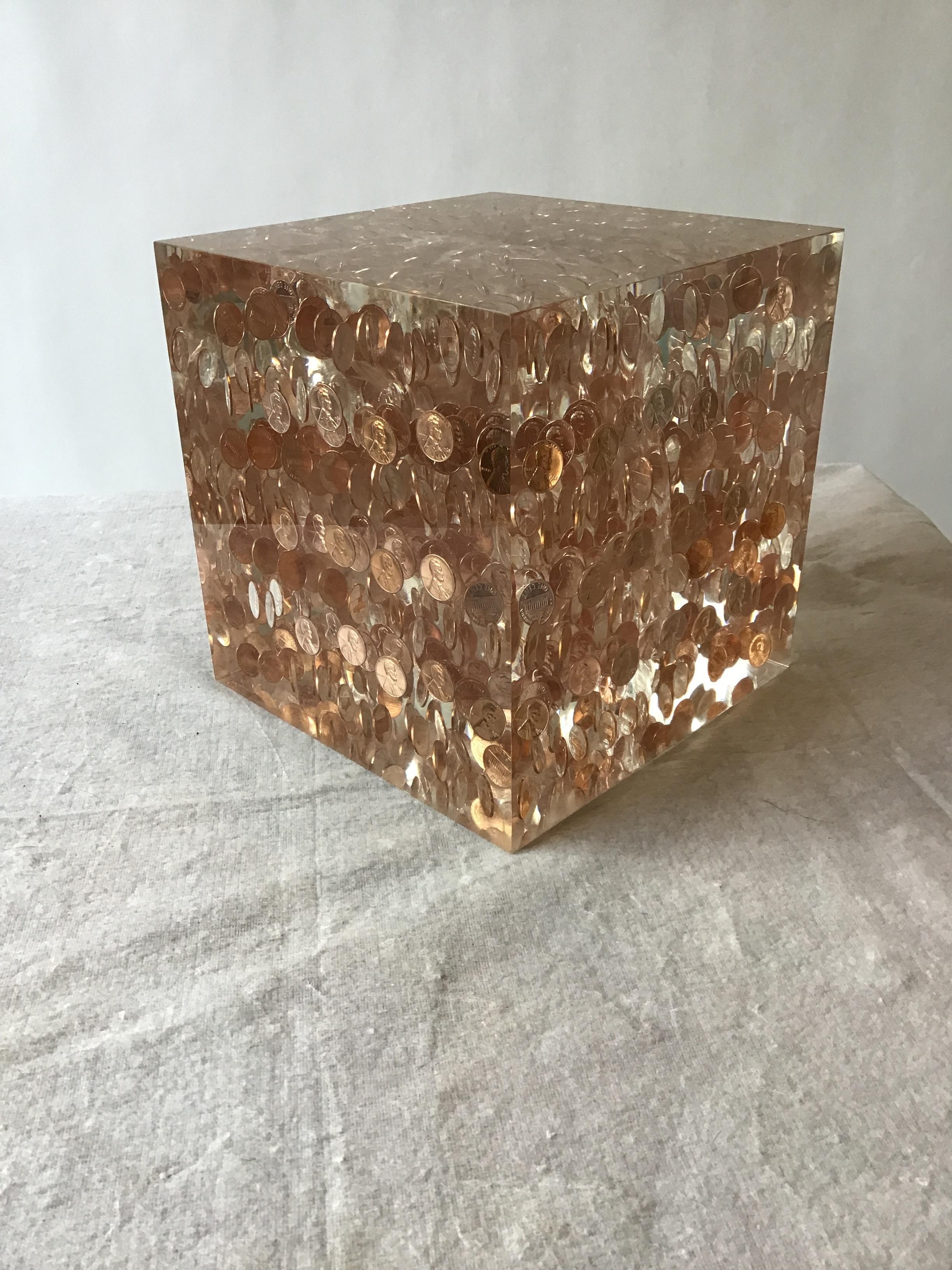 Large Lucite cube of 1968 pennies.