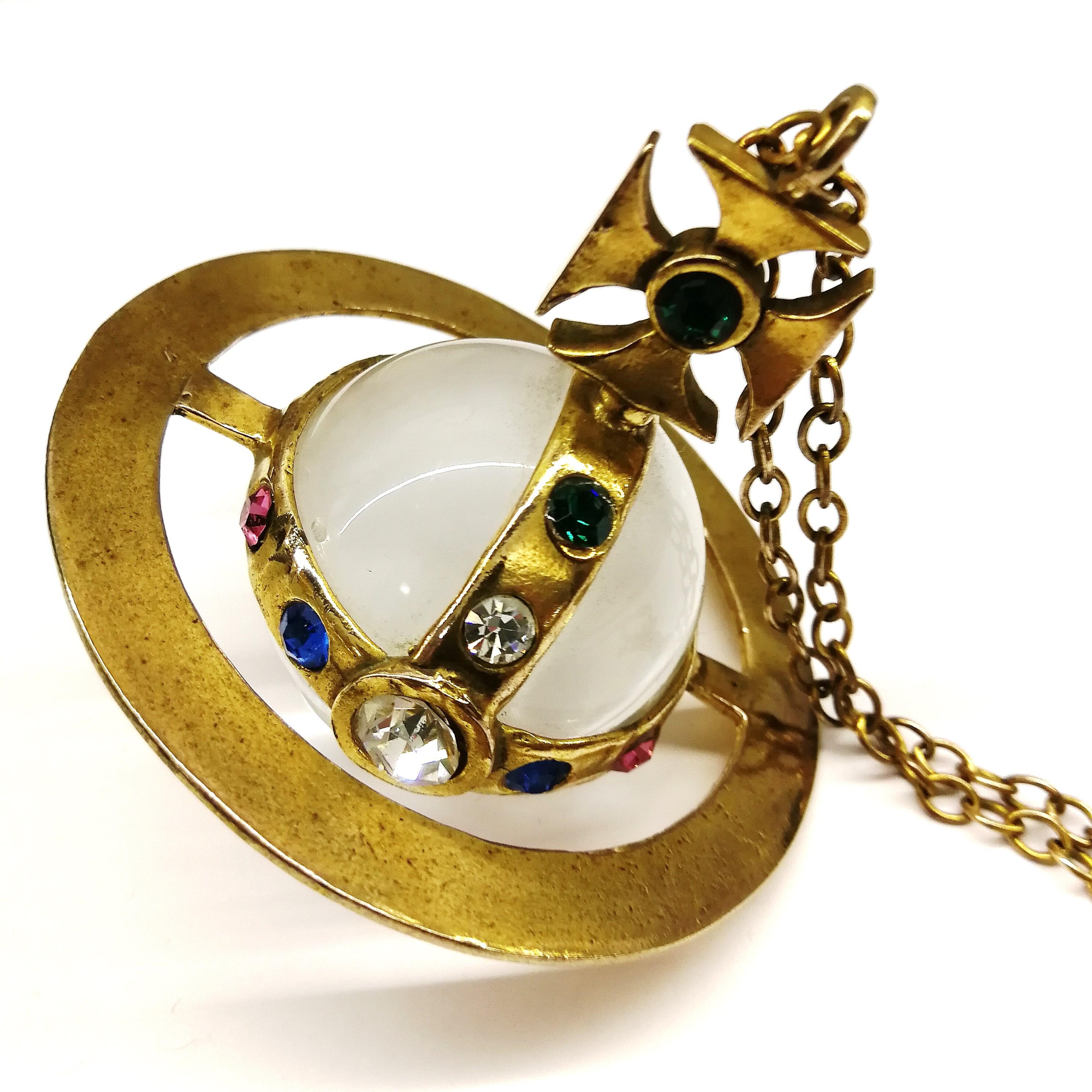 The 'symbol' of Vivienne Westwood, this is the iconic 'orb' that has adorns her clothing and accessories. In this incarnation, the large model of this pendant from the late 1980s, symbolising the whole ethos of this very British designer. Made from