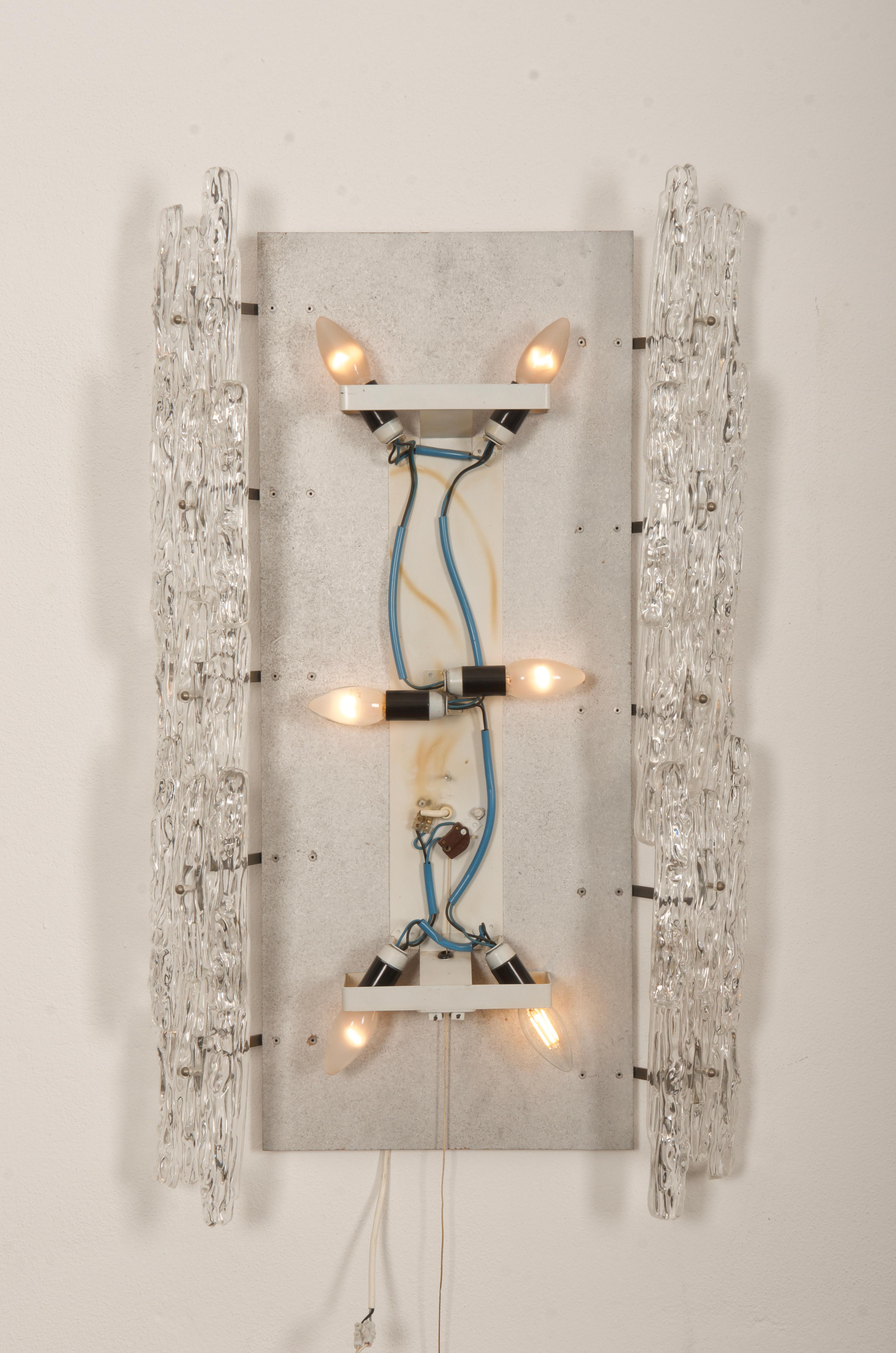 Made in the 1960s. Main frame steel plated with lucite elements, electric controled. 
 