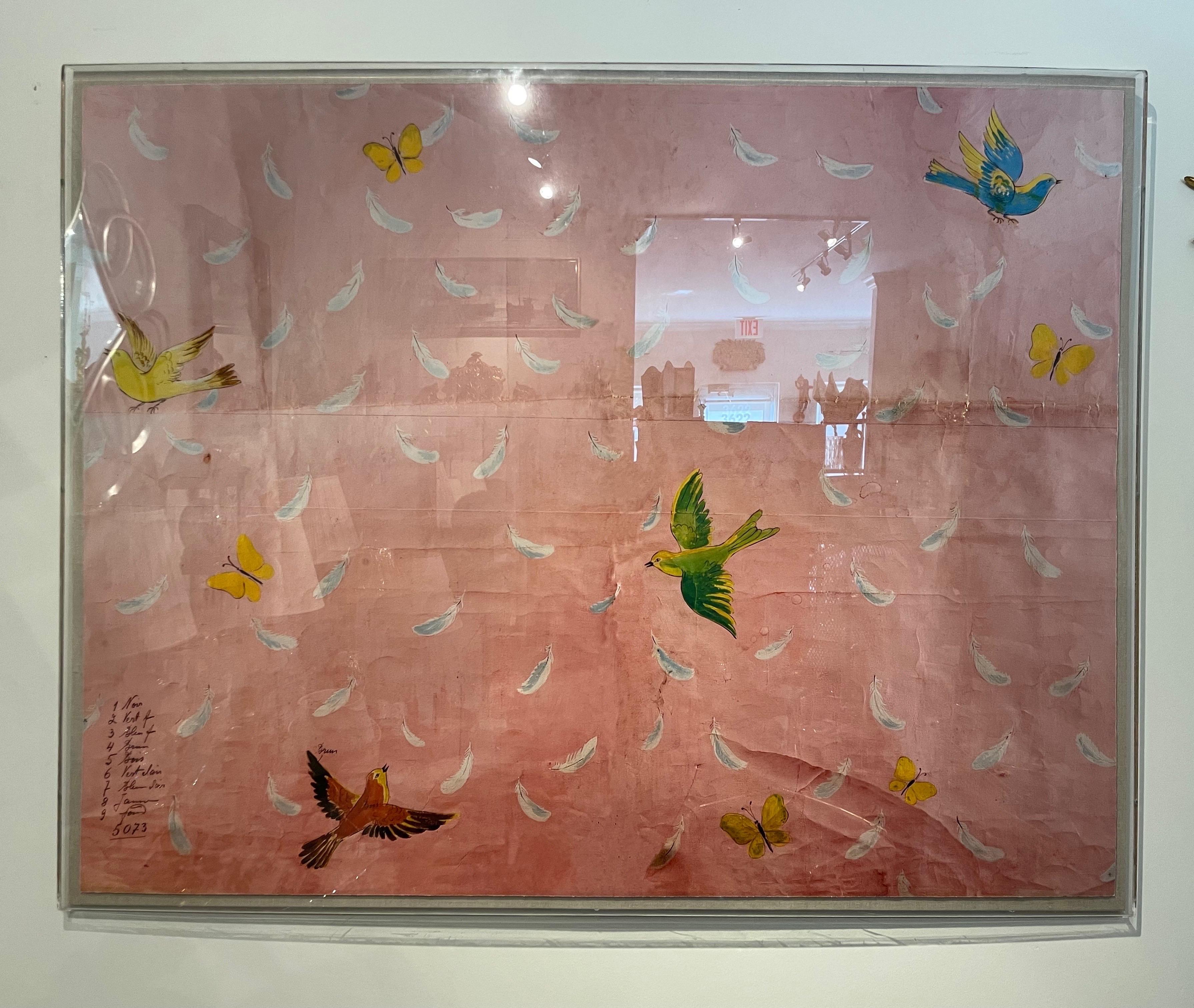 Large wallpaper print featuring flying birds,butterflies & falling feathers on a pink background. Mounted in a Lucite shadow box.