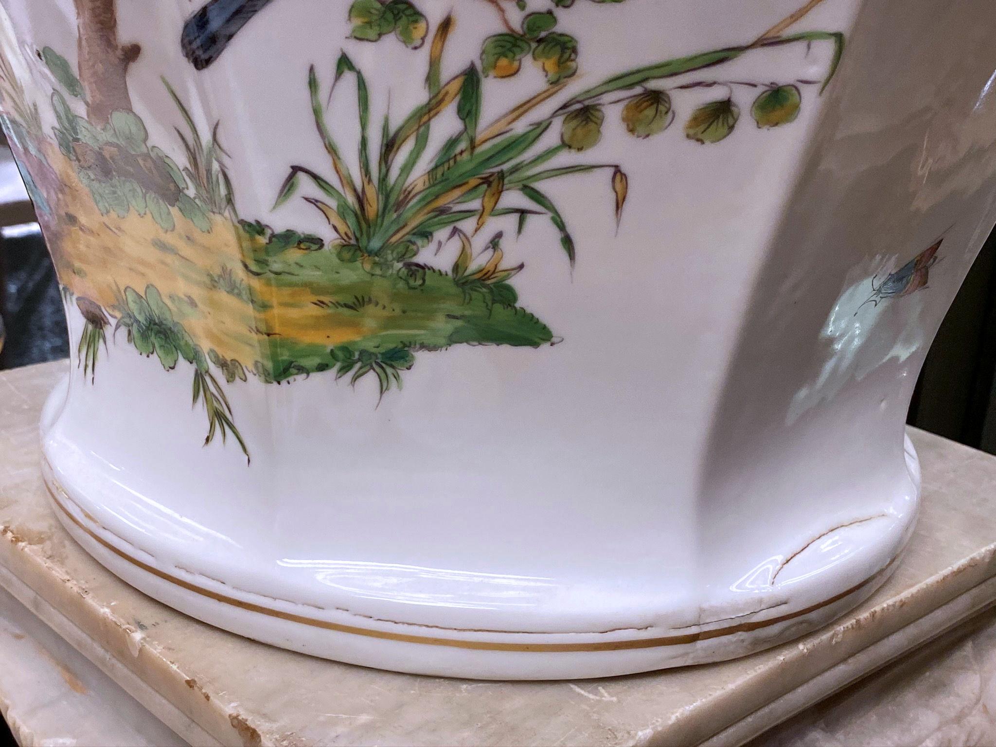 Large 19 century Ludwigsburg German porcelain vase and cover, signed, with hand-painted with butterflies and perched songbirds.