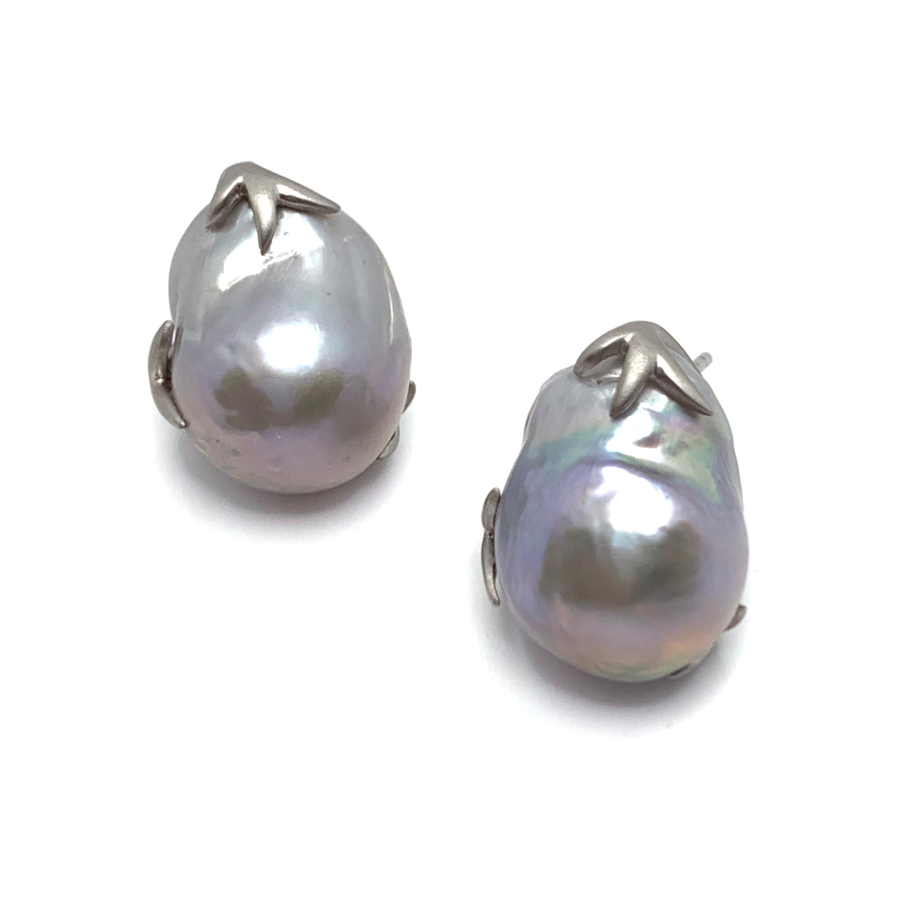 Beautiful pair of large lustrous grey freshwater baroque pearl earrings. The pair measures 15mm width and 20mm height, handset in platinum rhodium plated sterling silver (matte finish). Post-clip backs provide addition support and allow the earrings