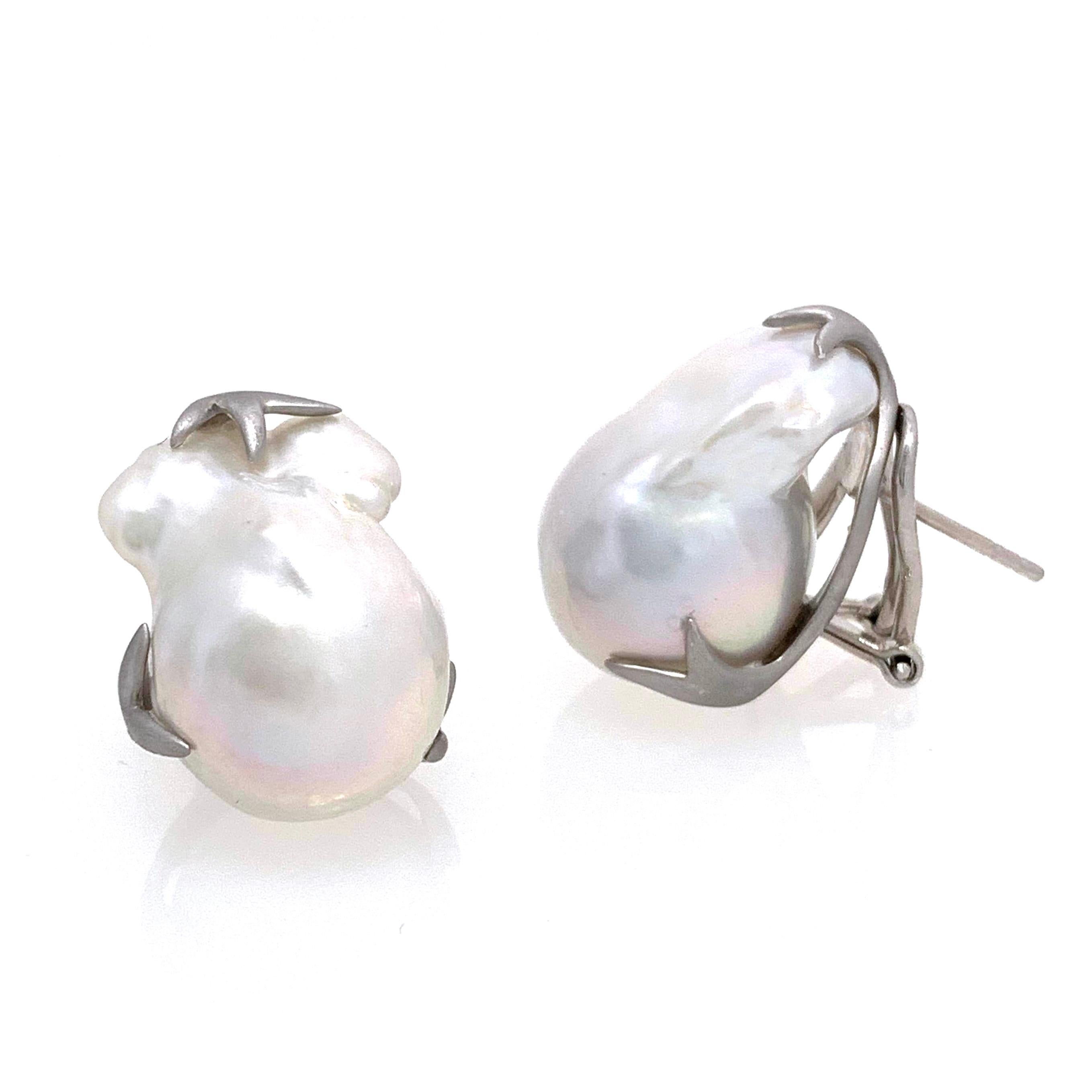 Beautiful pair of large lustrous freshwater baroque pearl earrings. The pair measures 16mm width and 23mm height, handset in platinum rhodium plated sterling silver (matte finish). Post-clip backs provide addition support and allow the earrings to