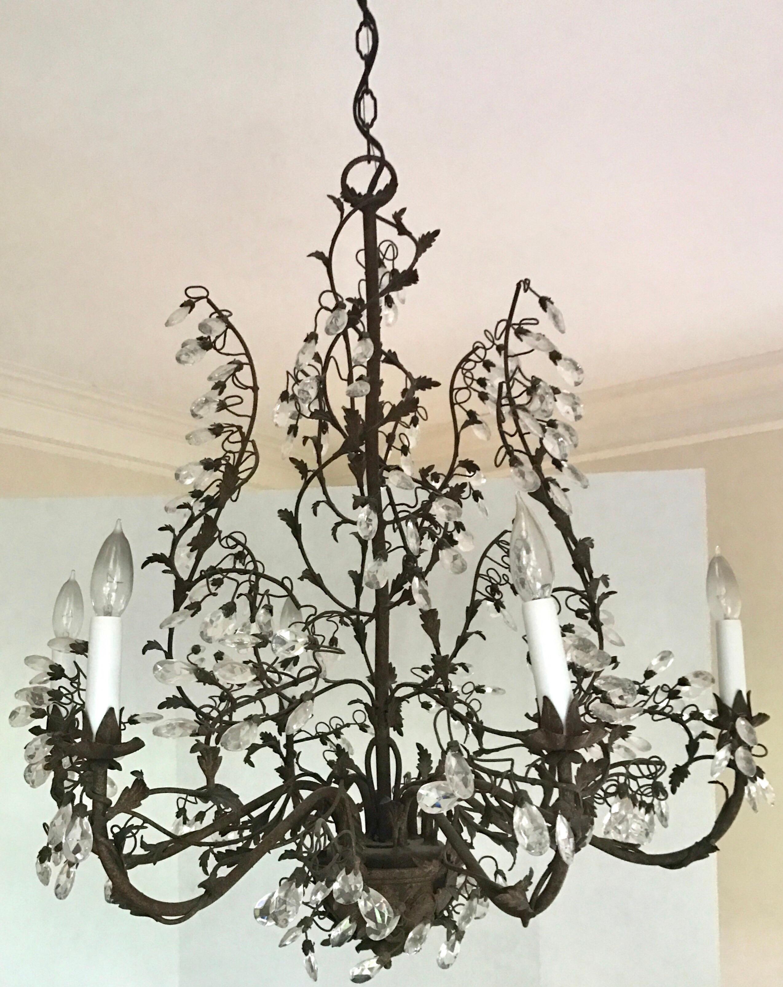 Magnificent tole vines with crystals running throughout six-light chandelier.