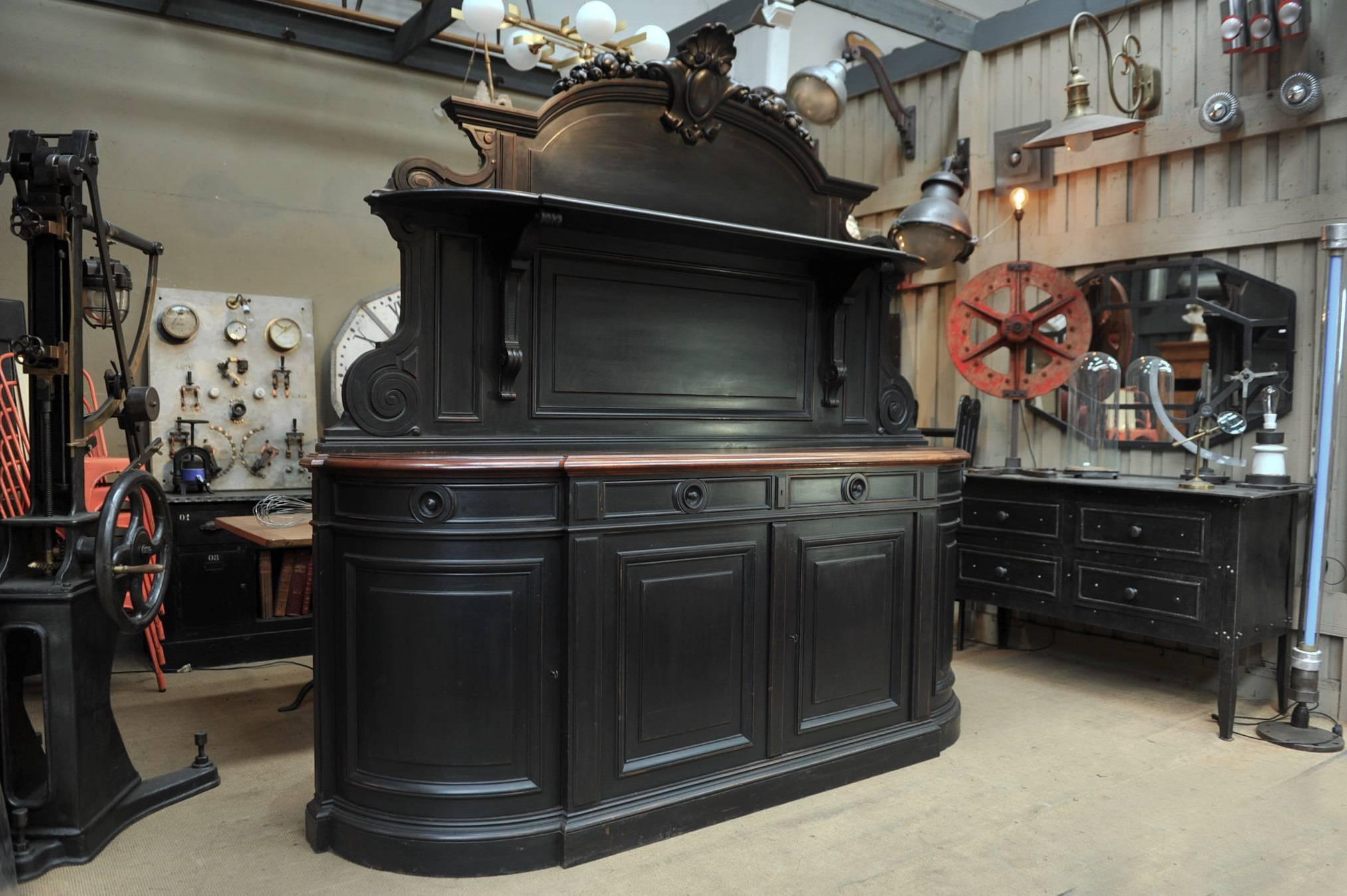 19th century French ebonized mahogany face and oak back Napoleon III Saint Hubert large two parts buffet with two curved doors and drawers on the sides.
Removable top part with molding and shelf with solid mahogany tray, circa 1850. Measures: