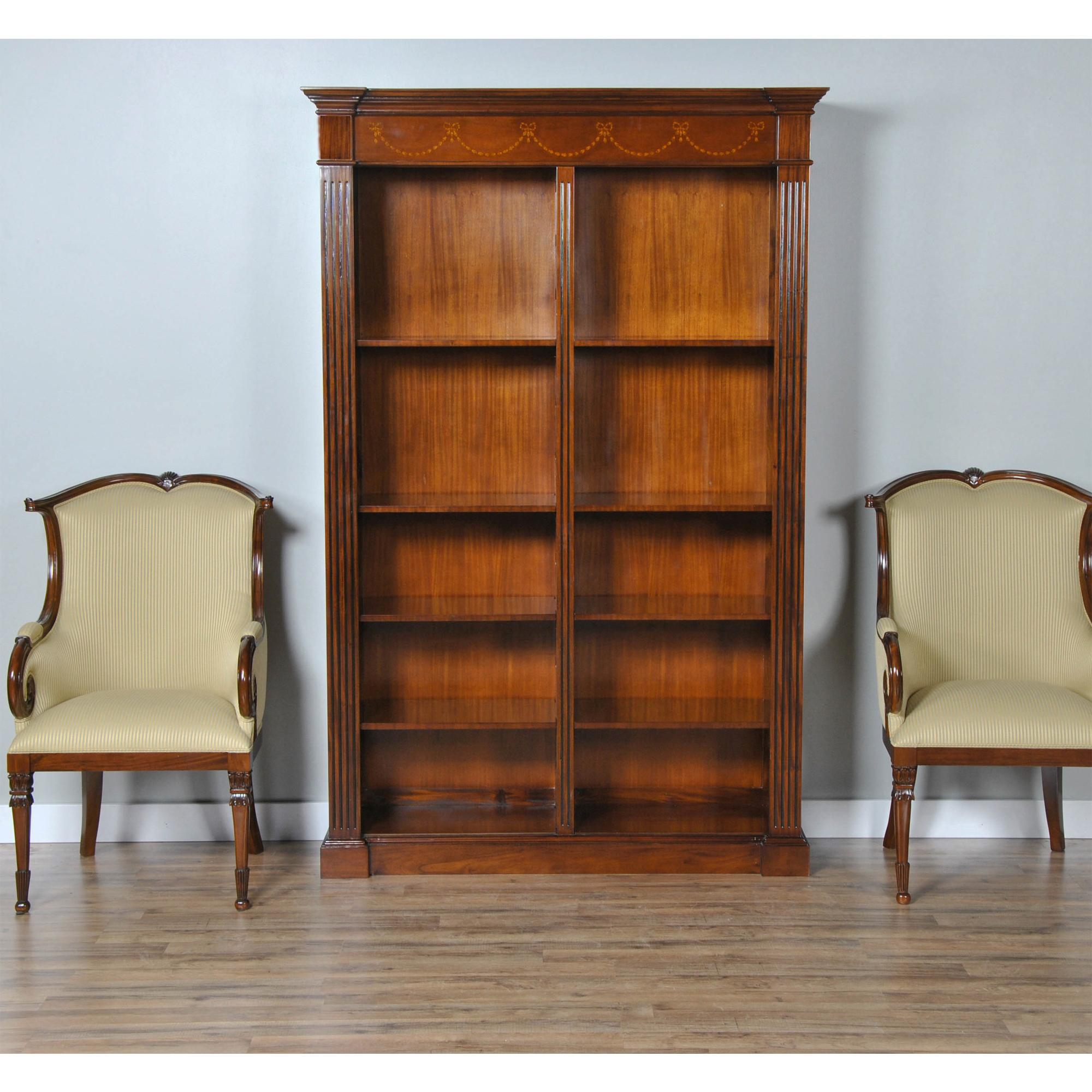 An excellent quality Large Mahogany Bookcase produced by Niagara Furniture. The top section features a moulded cornice with hand cut satinwood inlays arranged in a drape pattern. The open section being divided by a central reeded column for support