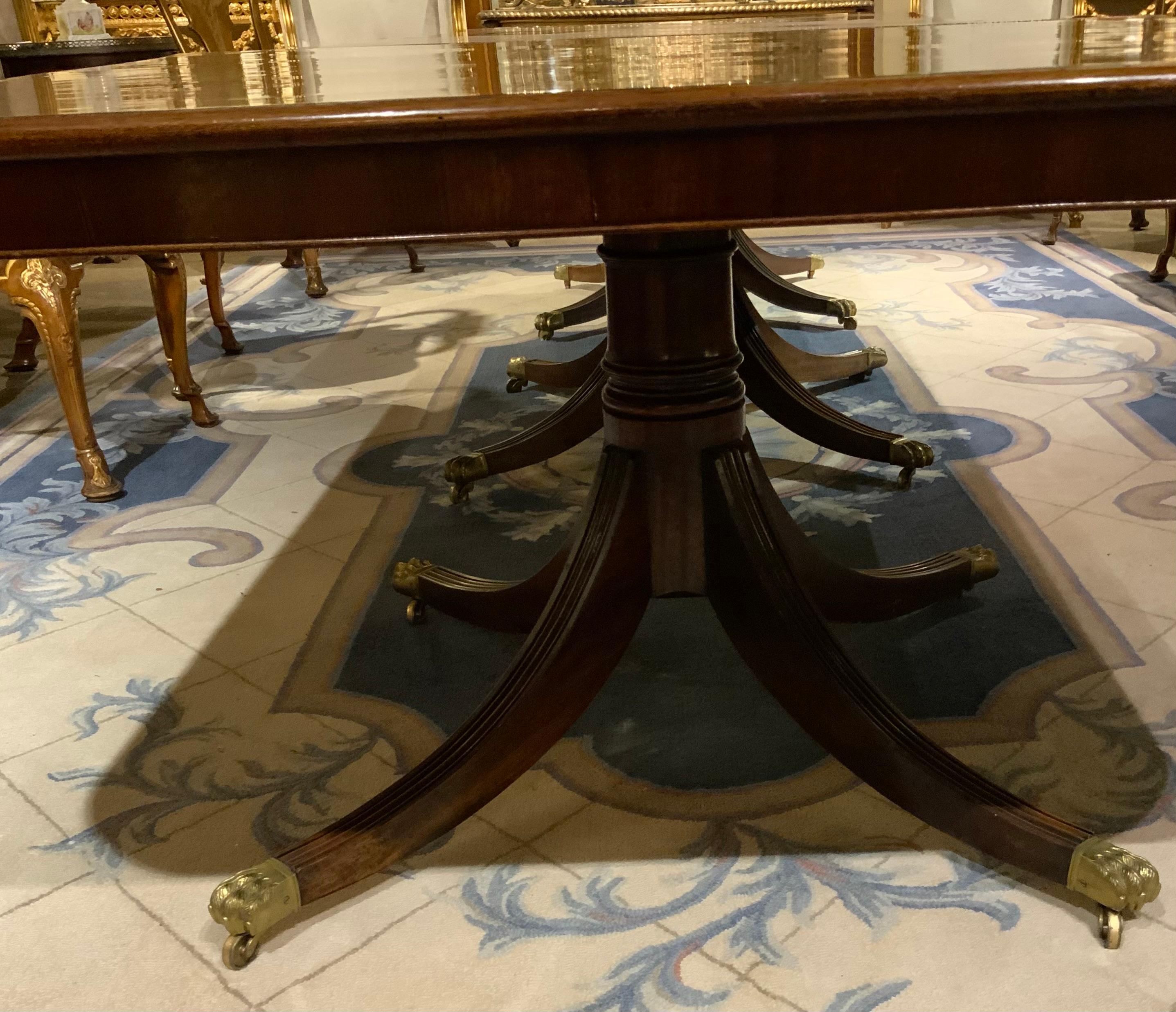 This English George III period mahogany table has three pedestals,
In the Sheraton taste, late eighteenth century, having a curved D end.
The top has been French polished and has a rich lustrous finish
Exhibiting the fine mahogany from which it