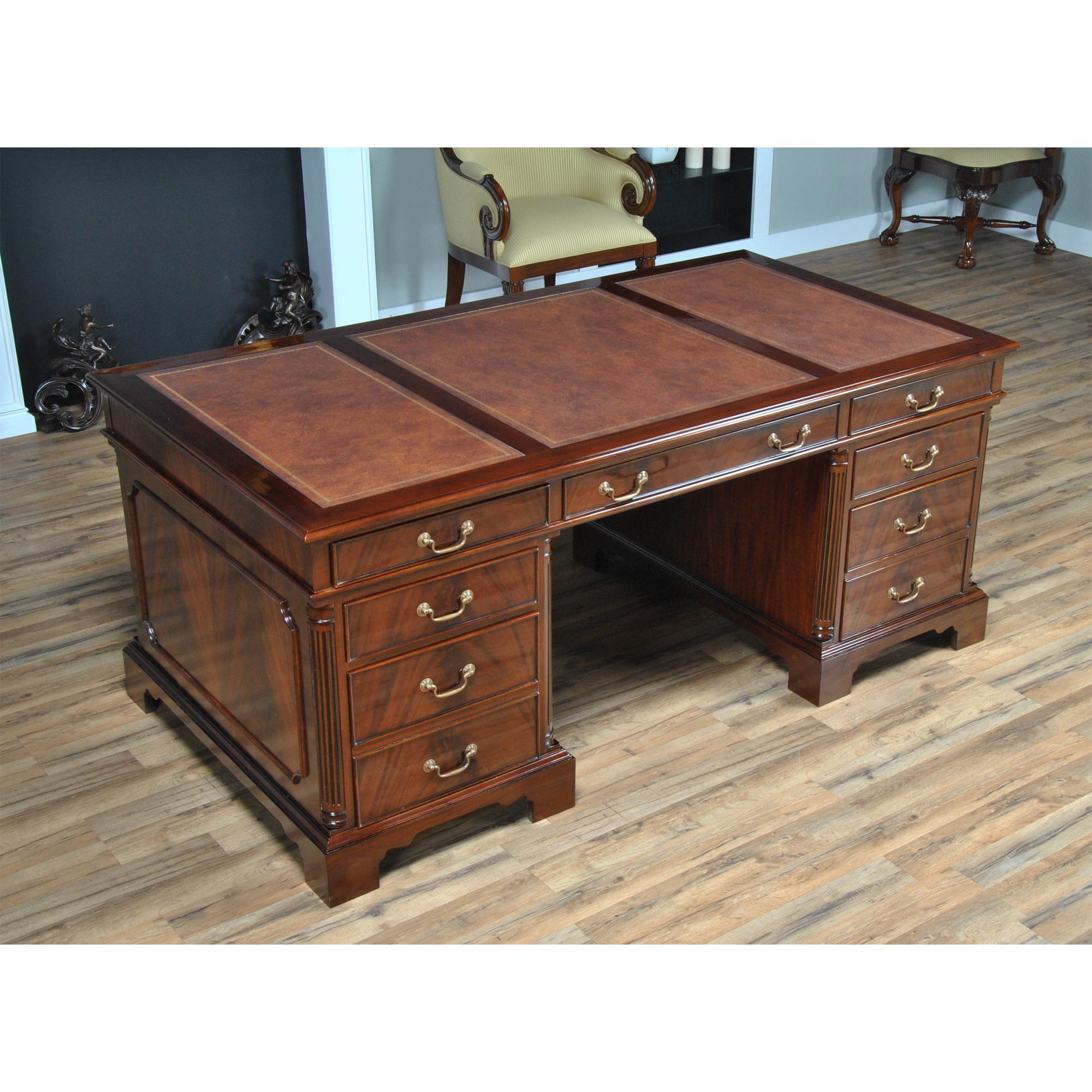 Equally suited for use either at the workplace or in a home office the Niagara Furniture Large Mahogany Executive Desk with tooled leather top is both decorative and functional. Built in three sections for easy handling and installation the top