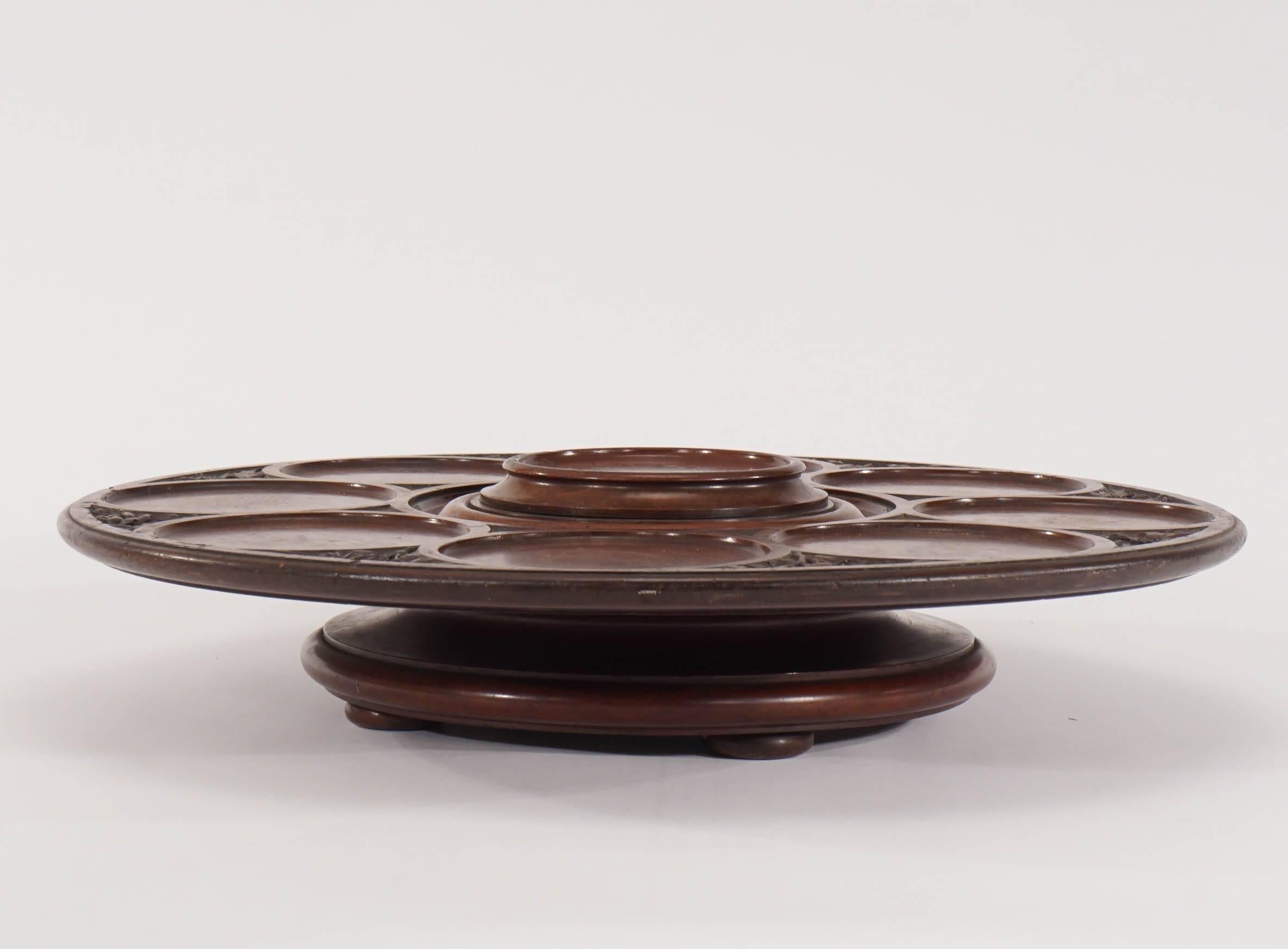 An unusually large and beautifully decorated Lazy-Susan will be the perfect focal point on a table. Also wonderful for h'ors d'oeuvres, desserts and condiments at a buffet table, this smoothly rotating tray has nine circular framed indentations to