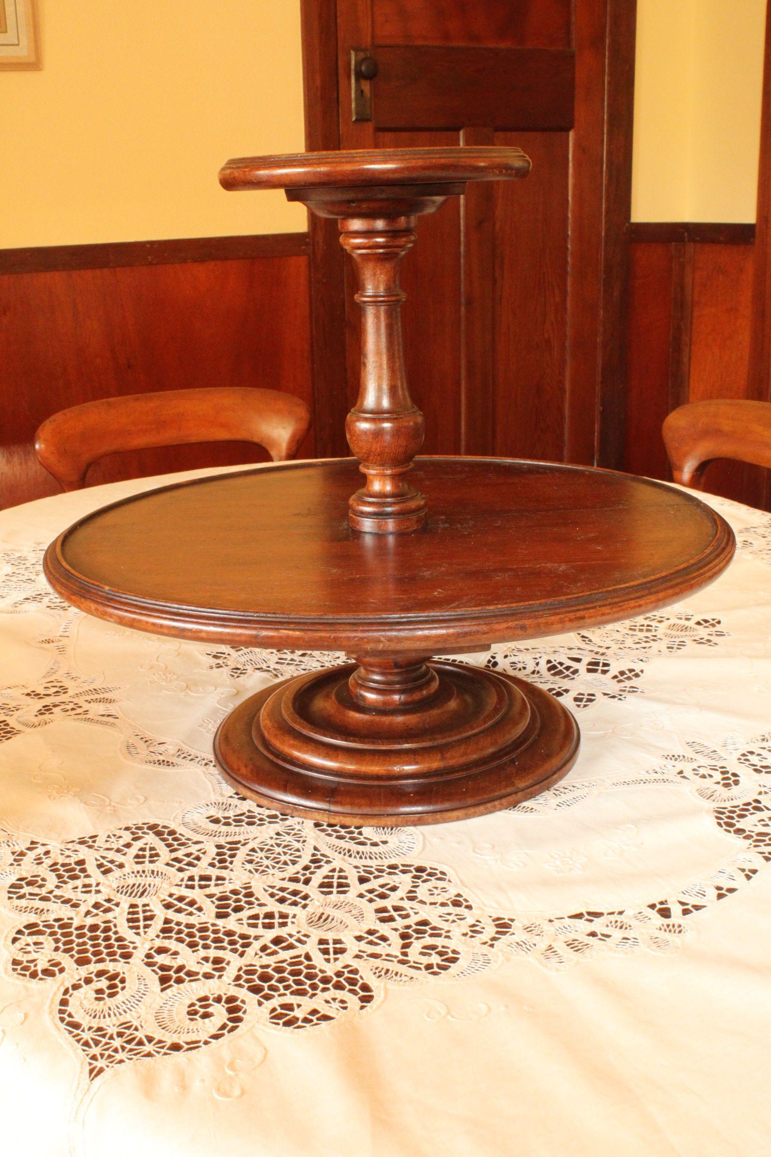 This two tier Lazy Susan is made of mahogany with a diameter of 533 mm (21 inches), and standing 470 mm (18.5 inches) high, resting on a nicely turned, stepped base. It is quite heavy, weighing in at 5.4 kgs (just under 12 pounds). A Lazy Susan