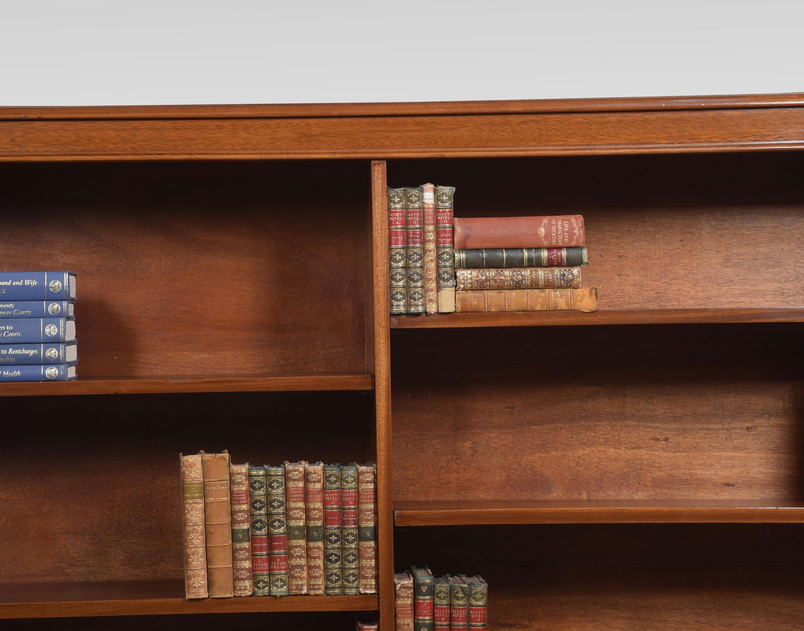 Mahogany open bookcase, the rectangular top having moulded edge. Above two bays of adjustable shelves. All raised up on squat cabriole legs
Dimensions
Height 54.5 inches
Width 77 inches
Depth 12.5 inches.