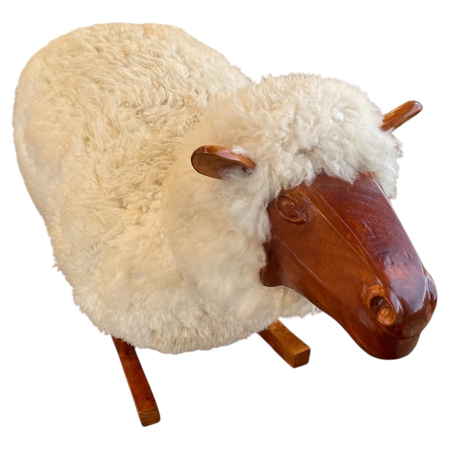 An original design and make by the artist and designer Jose Gomez, the one of a kind sheep rocker. Outfitted with authentic New Zealand wool, this piece is a beautiful take on the beloved child's toy. While it is a larger size it makes for a great