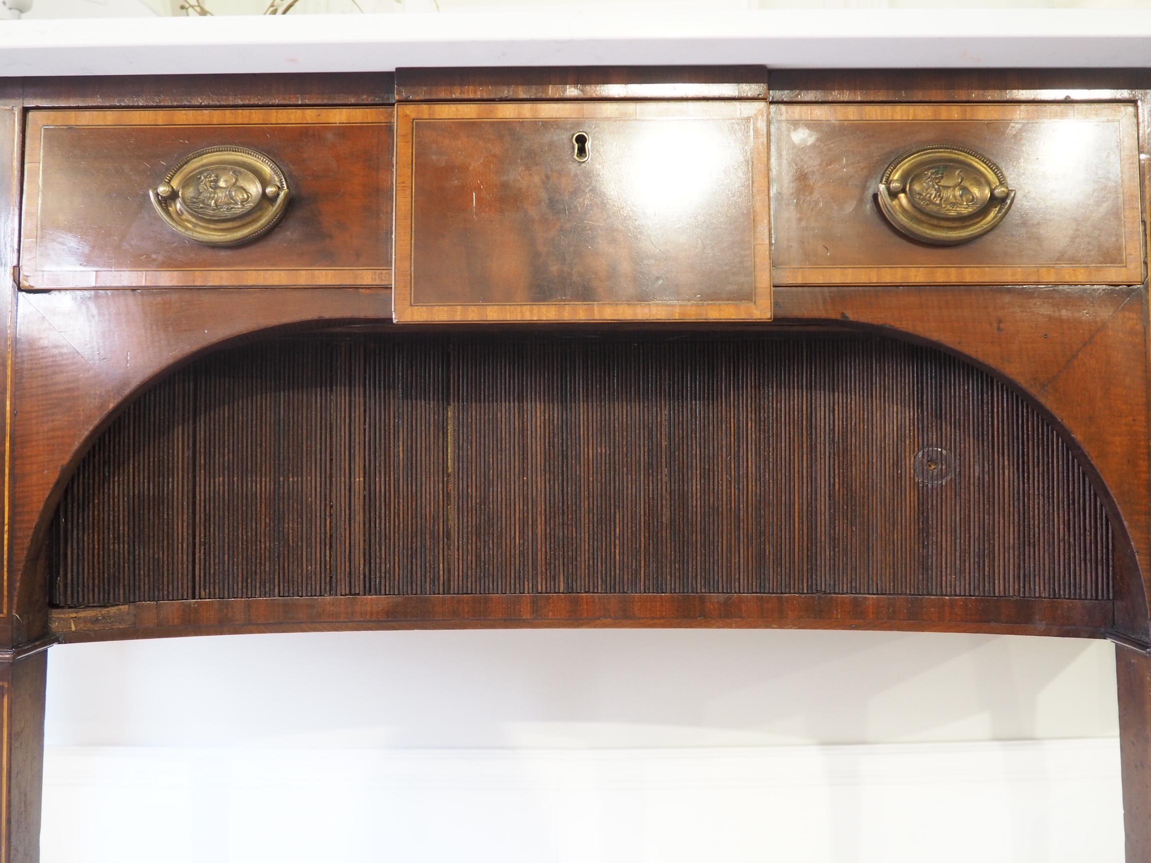 A beautiful antique bow front mahogany sideboard, with a new cut curved marble top. It features a drawer in the centre with larger drawers on each end. 

It sits on fluted legs and has the original brass pull handles.

 

The piece is in