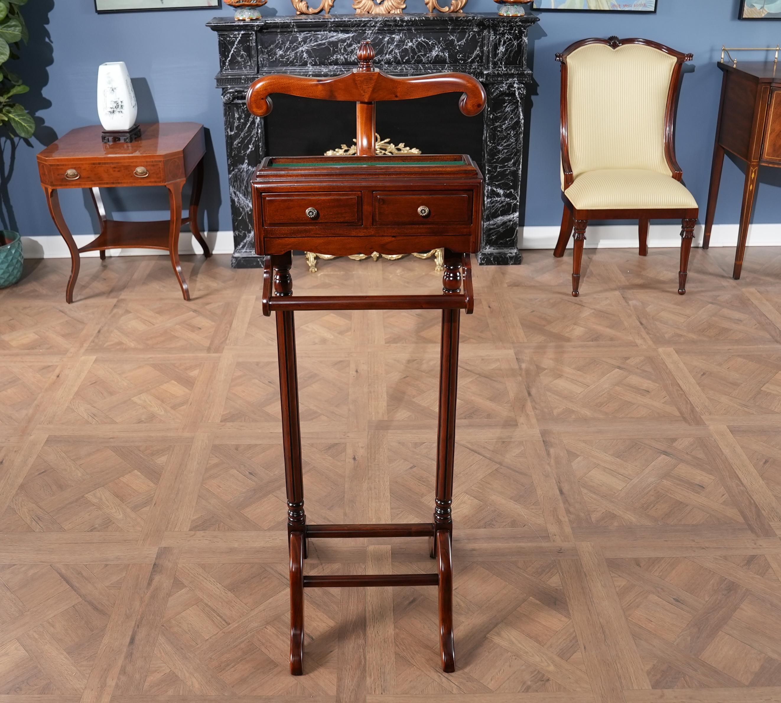 A most useful and decorative item, the Large Mahogany Valet as produced by Niagara Furniture. Using select solid mahogany and mahogany veneers our artisans produce this item using great quality construction as evidenced by the hand carved details,