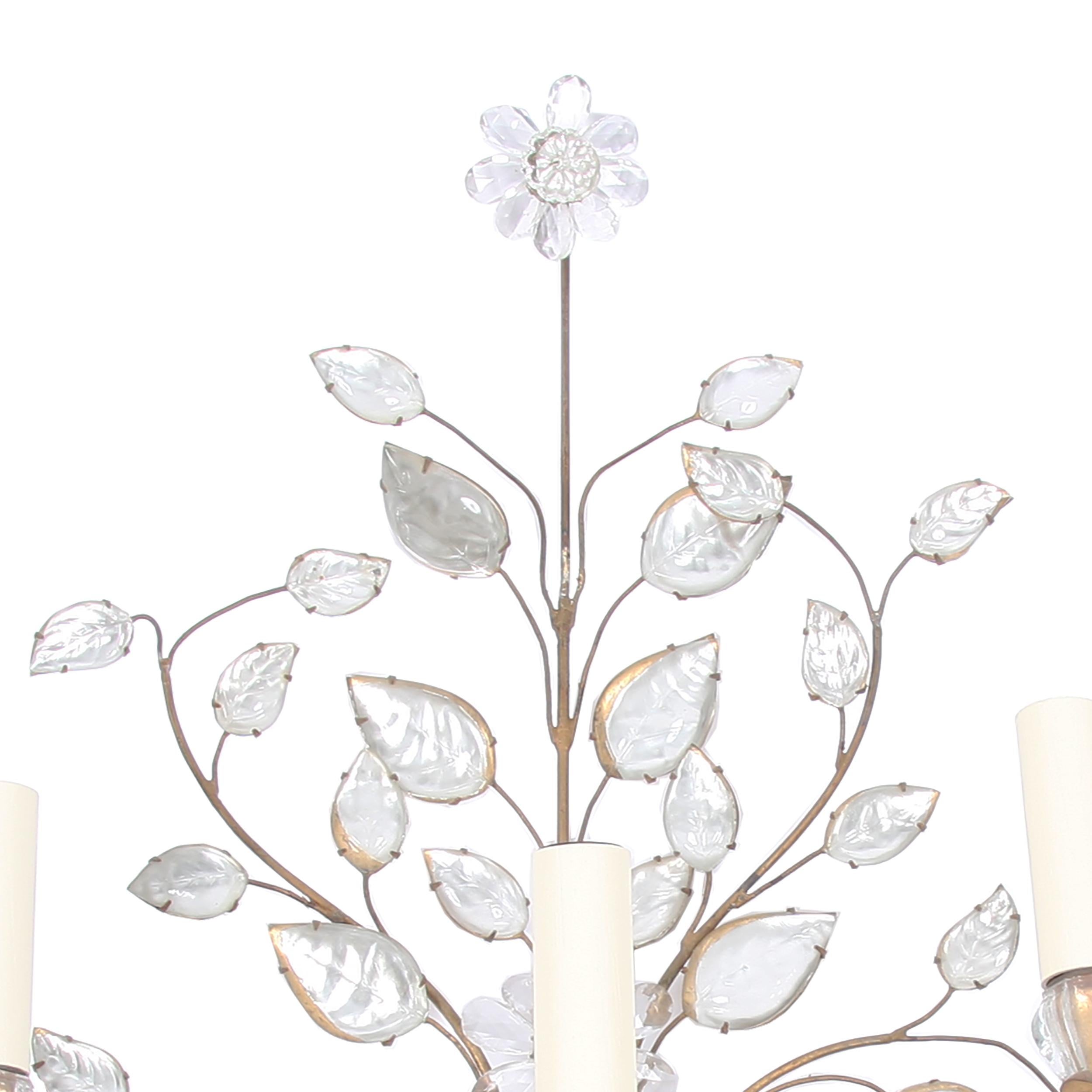 
This is a gorgeous wall sconce from Maison Baguès. Made from gilt metal and glass, with a flower and urn design.

Made in France in the 1950s. Stunning.

Since the 1860s, the renowned French luxury lighting atelier Maison Baguès has been