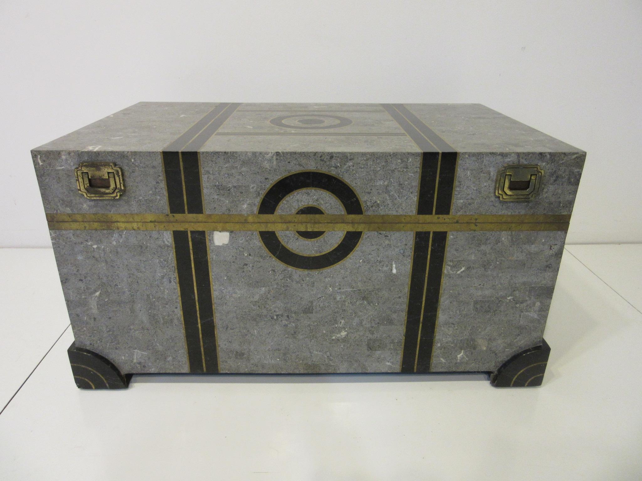 A well-crafted tessellated marble coffee table chest with gray, charcoal, mixed marble and inlay brass details to all sides. The inside is covered in a tight black velvet styled material as well as the bottom of the chest, the hinges and handles are