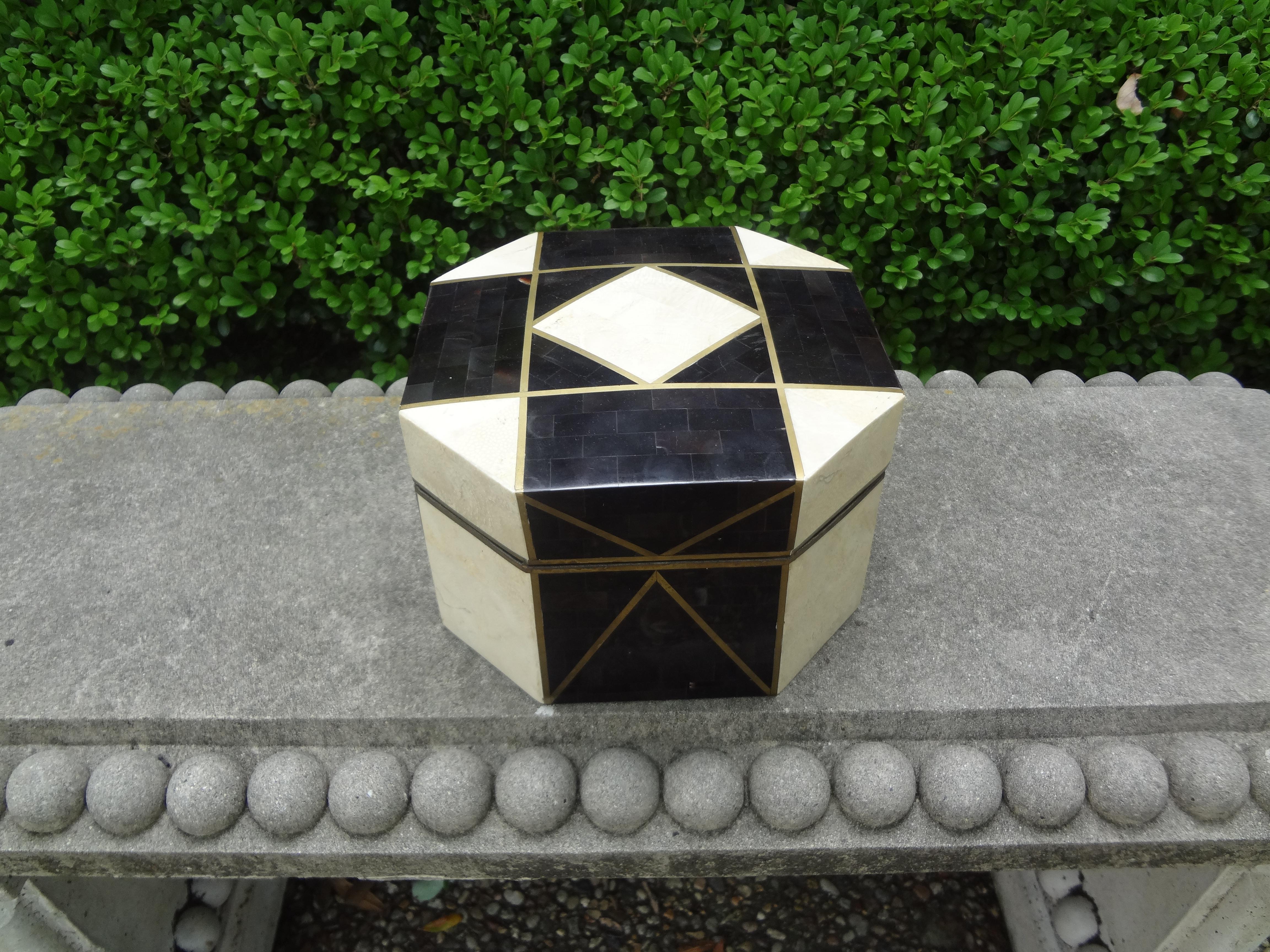 Stunning large geometric tessellated stone, horn and brass box in the style of Maitland Smith. This gorgeous octagonal shaped tessellated decorative box, coffee table box or jewelry box is comprised of tessellated pieces of white stone and black