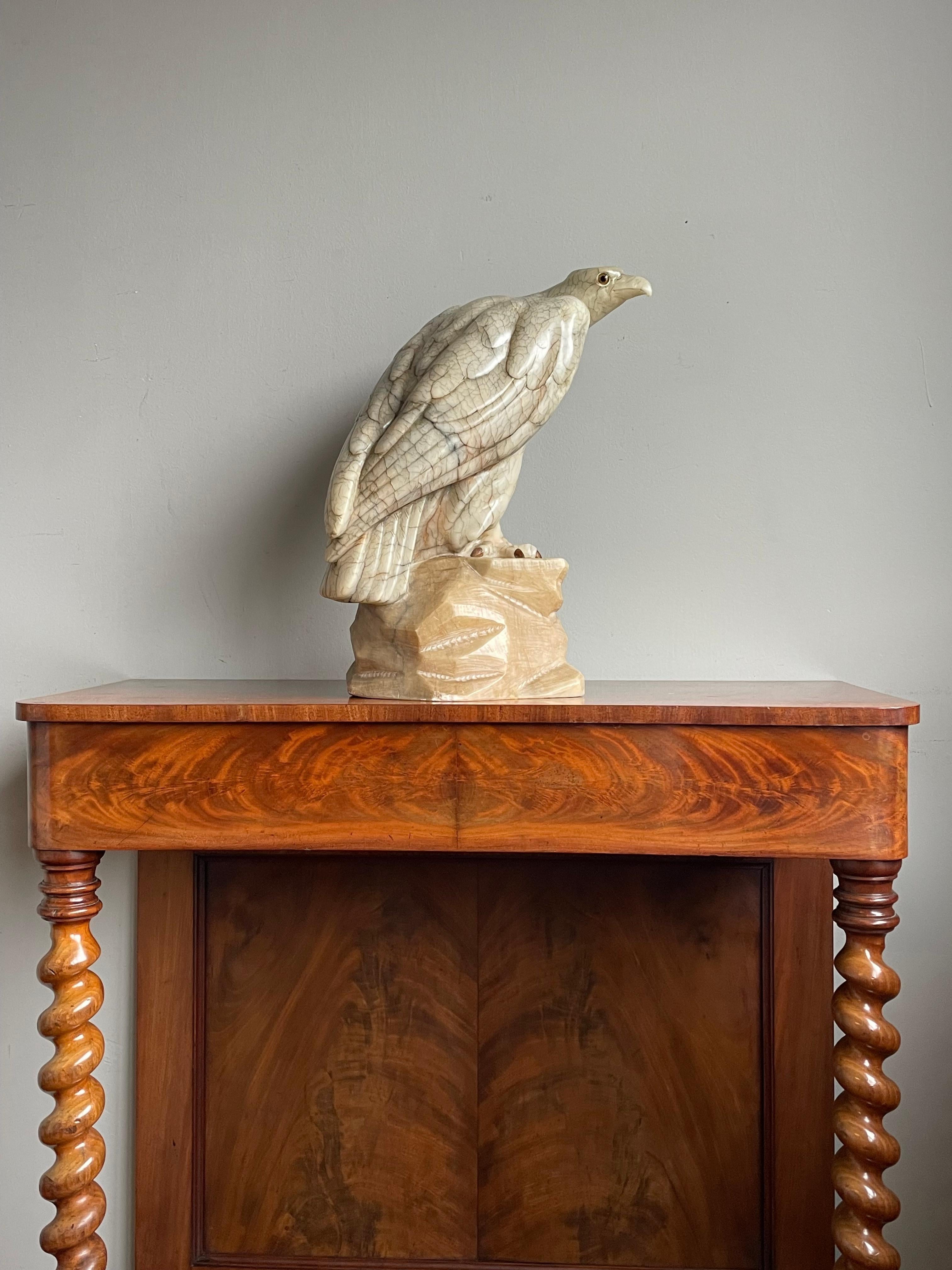 Magnificent hand-carved eagle on a rock sculpture.

Most people are not capable of drawing a picture of an eagle, but this artist has sculpted a majestic and lifelike eagle out of a single rock of alabaster. That, to us, is amazing and it takes a