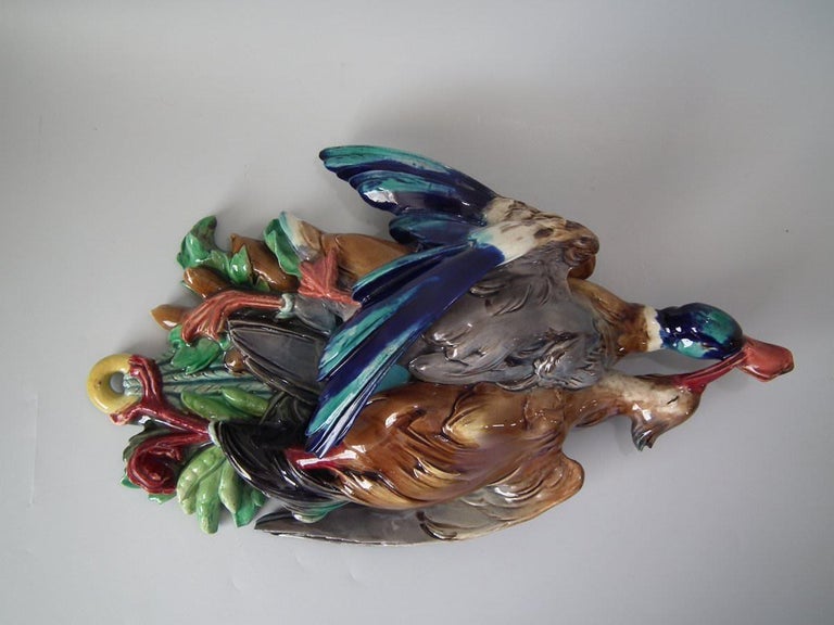 Majolica wall pocket which features game birds (a Mallard duck and another unknown bird). Colouration: brown, blue, green, are predominant. Bears a pattern number, '1109' and '38013'.