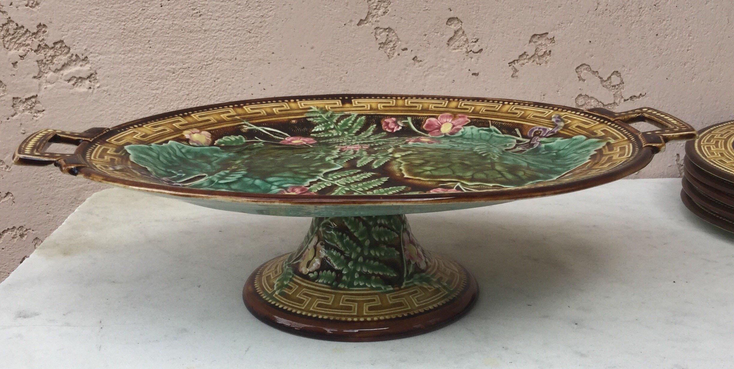 French oval Majolica cake stand or comport with leaves, ferns, and pink flowers, circa 1880-1890, signed Choisy le Roi.