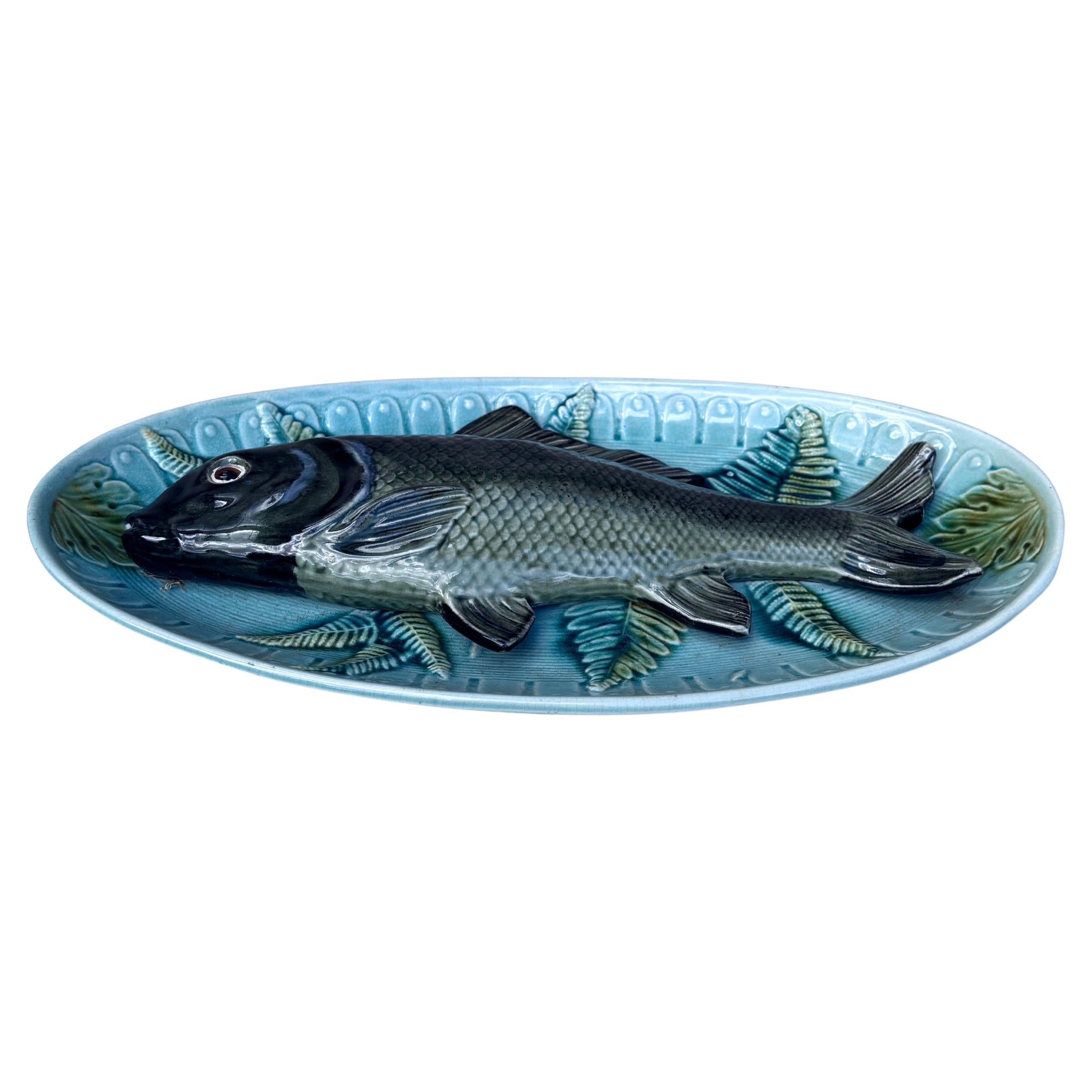 Large French Majolica Palissy wall platter circa 1920.
Decorated with a large fish on a various leaves background.
17.5 by 9.4 inches.
