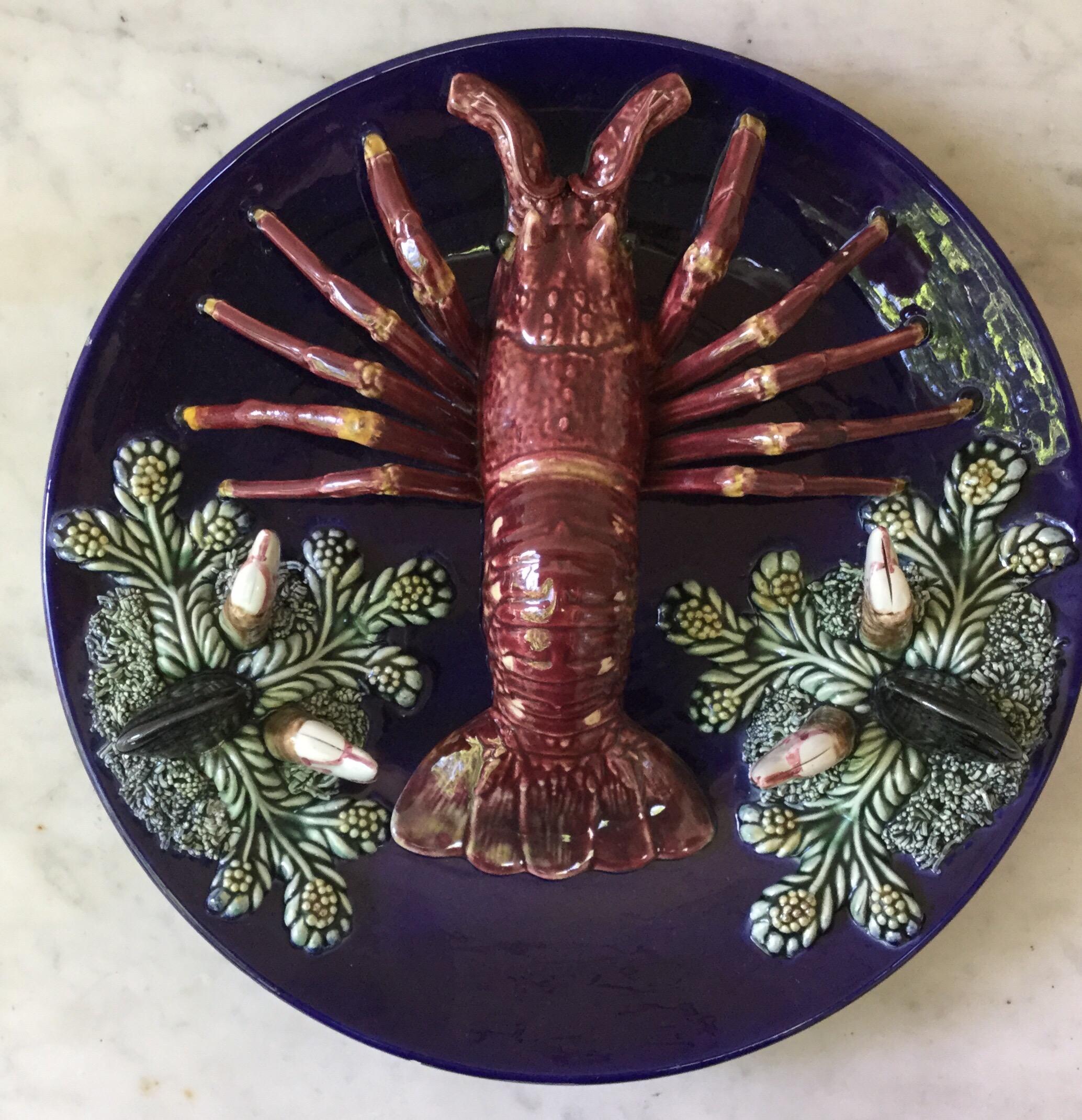 Large Majolica Palissy lobster wall platter Vallauris, circa 1950 decorated with shells and seaweeds.
Nautical style.