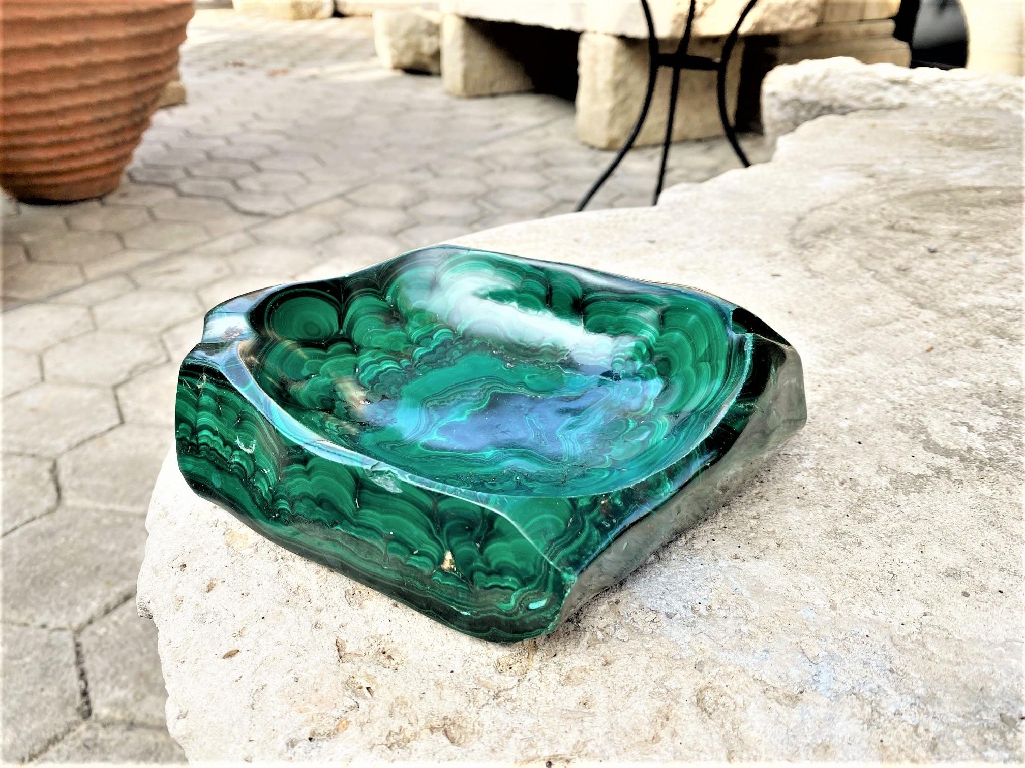 Great and unique shape carved malachite stone ashtray or vide poche. Imposing item, stunning color and pattern which makes it unique . Natural malachite sculpture . Some are called vide poche or ashtray Dresser caddy or valet tray and sundries bowl